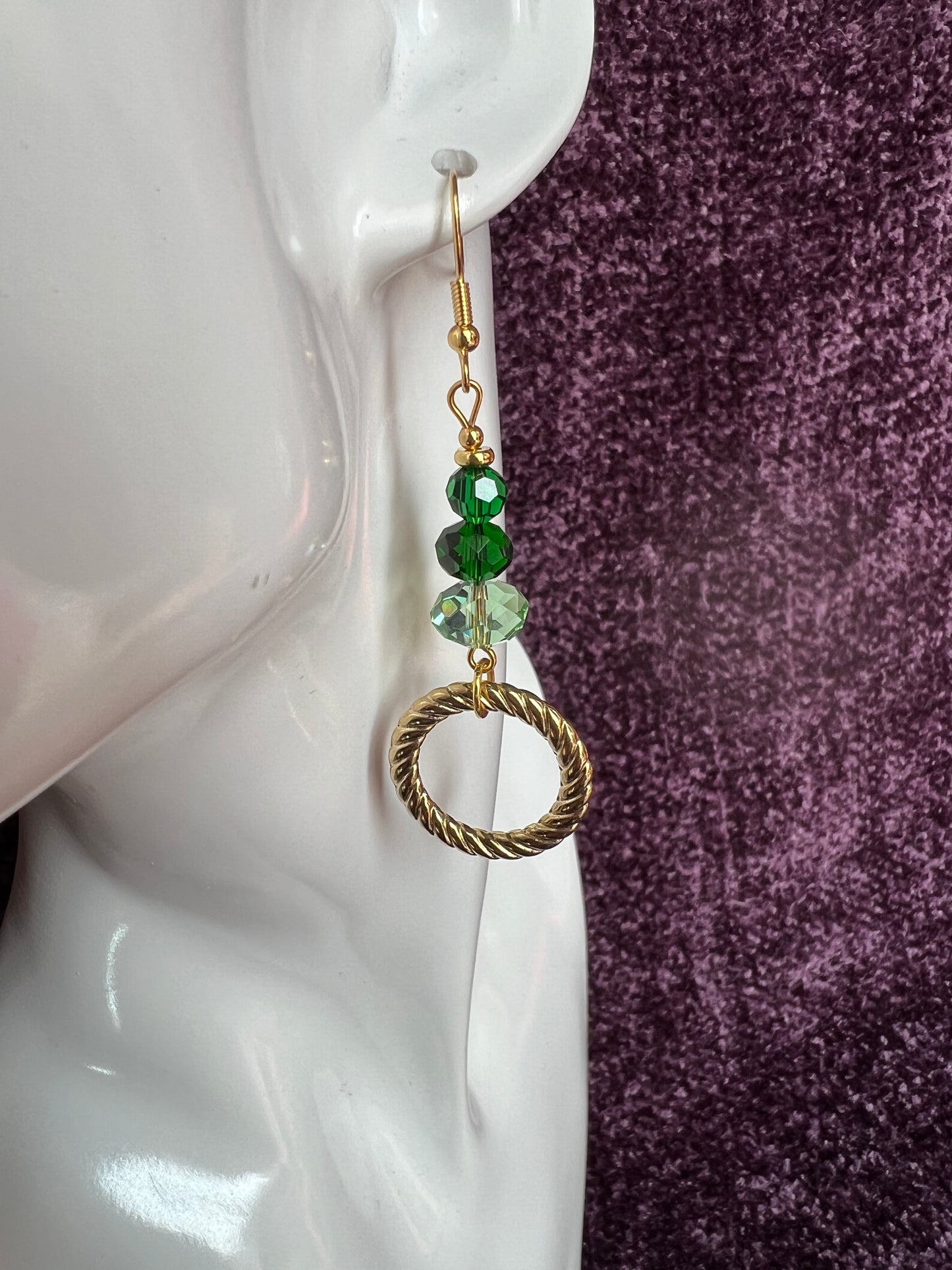 Earrings- Gold plated stainless steel ear hooks, gold plated metal with various green colored crystals.