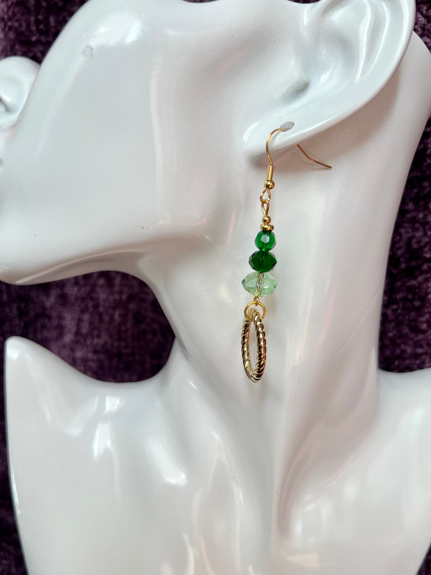 Earrings- Gold plated stainless steel ear hooks, gold plated metal with various green colored crystals.
