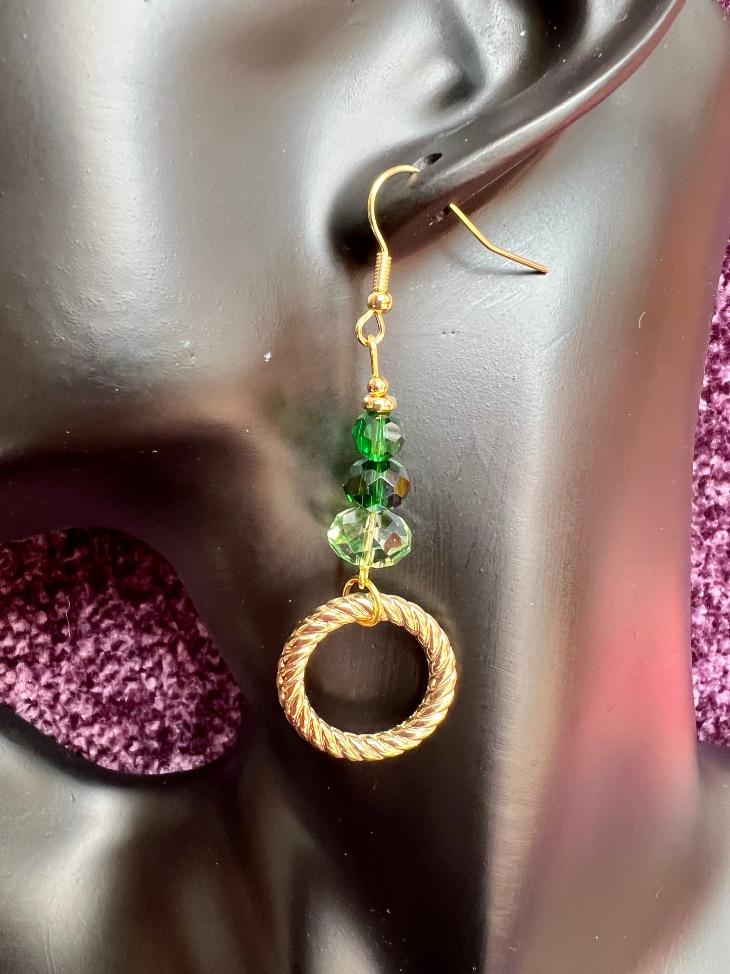 Earrings- Gold plated stainless steel ear hooks, gold plated metal with various green colored crystals.