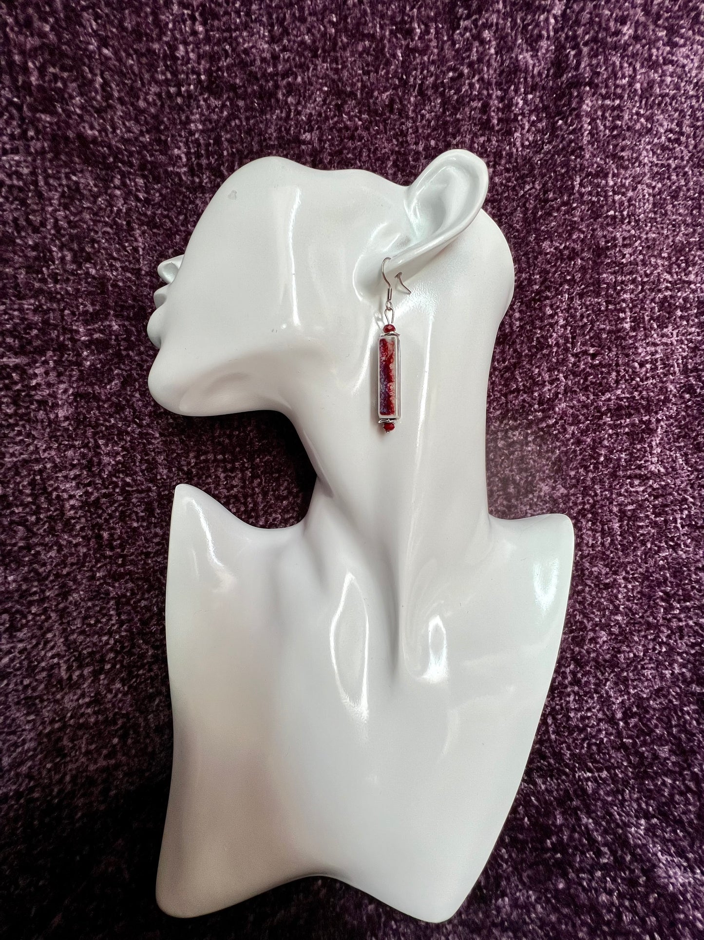 Earrings- Stainless steel ear hooks, red crystals, and ceramic rectangular tube beads in red and blue glaze.