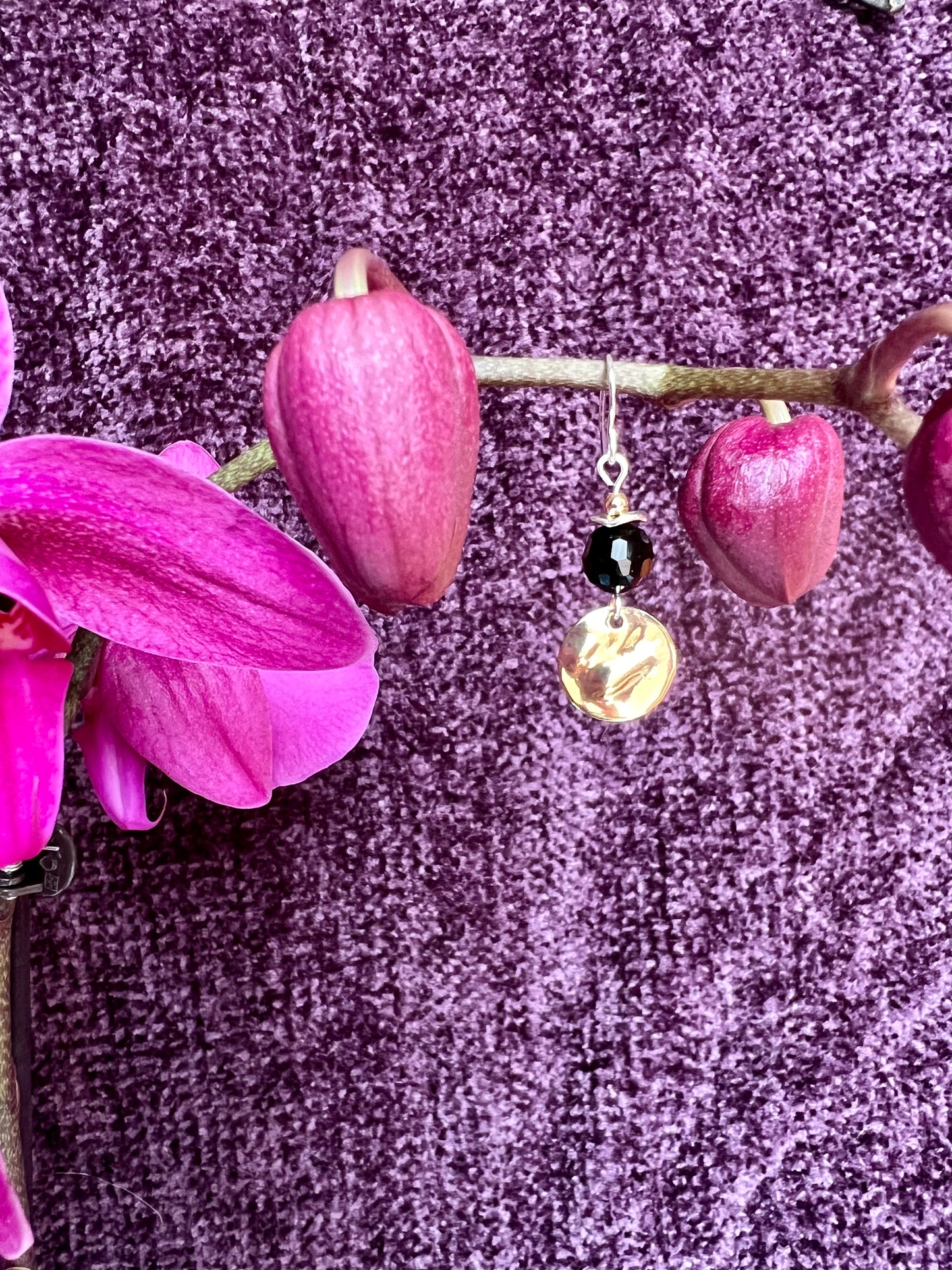 Earrings- Gold and silver plated metal with opaque black crystal beads.