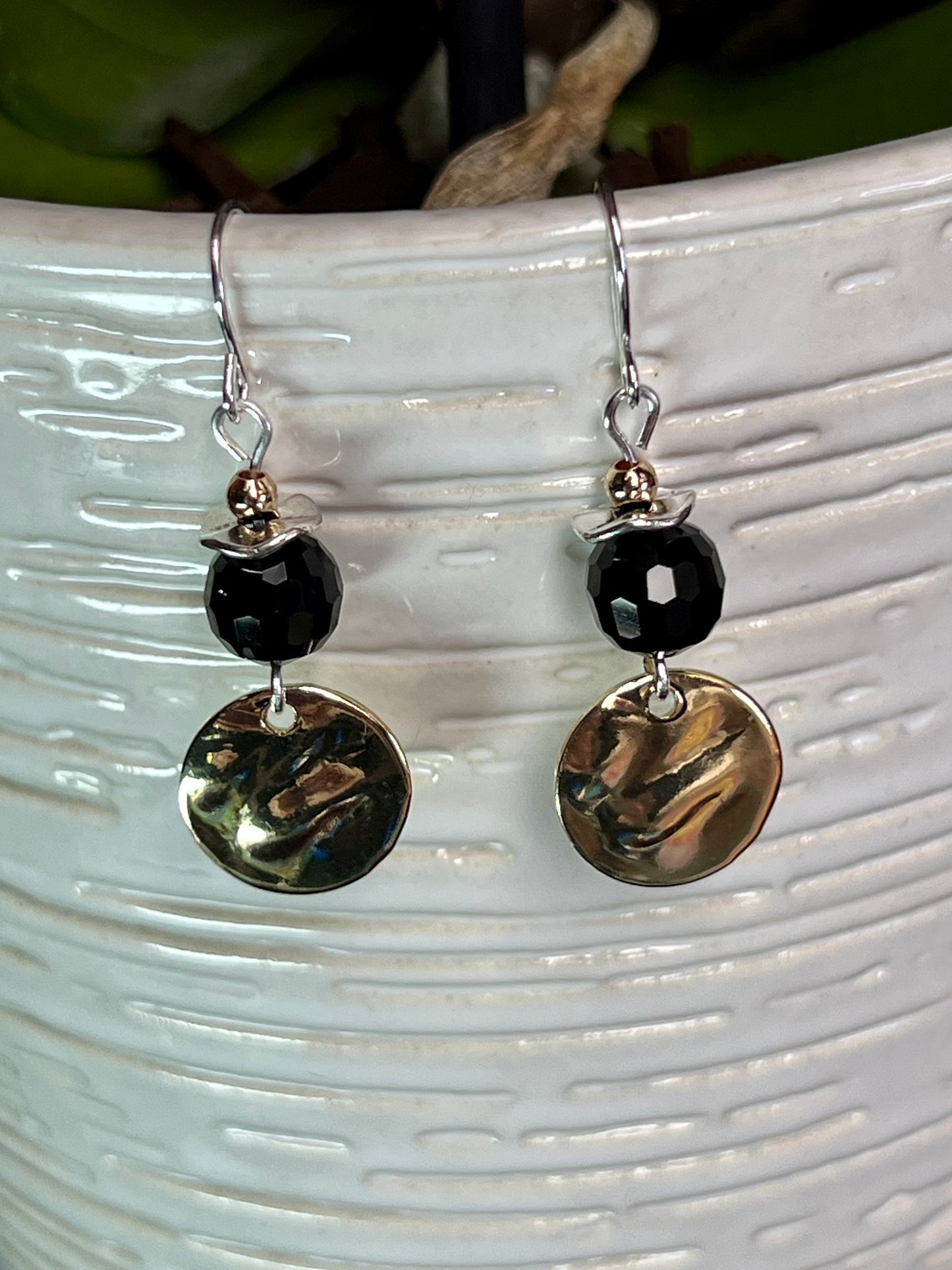 Earrings- Gold and silver plated metal with opaque black crystal beads.