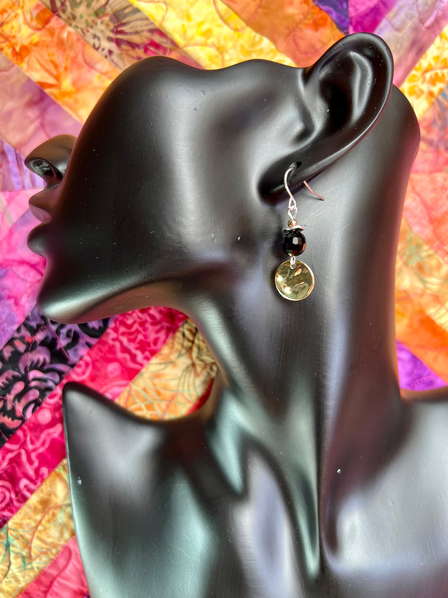 Earrings- Gold and silver plated metal with opaque black crystal beads.