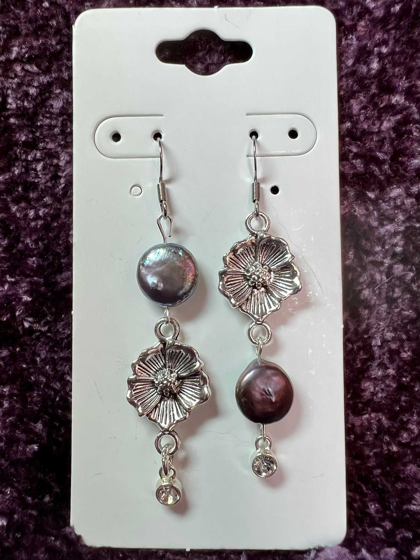 Earrings- Stainless steel ear hooks, silver plated metal with freshwater coin pearls. Asymmetrical.