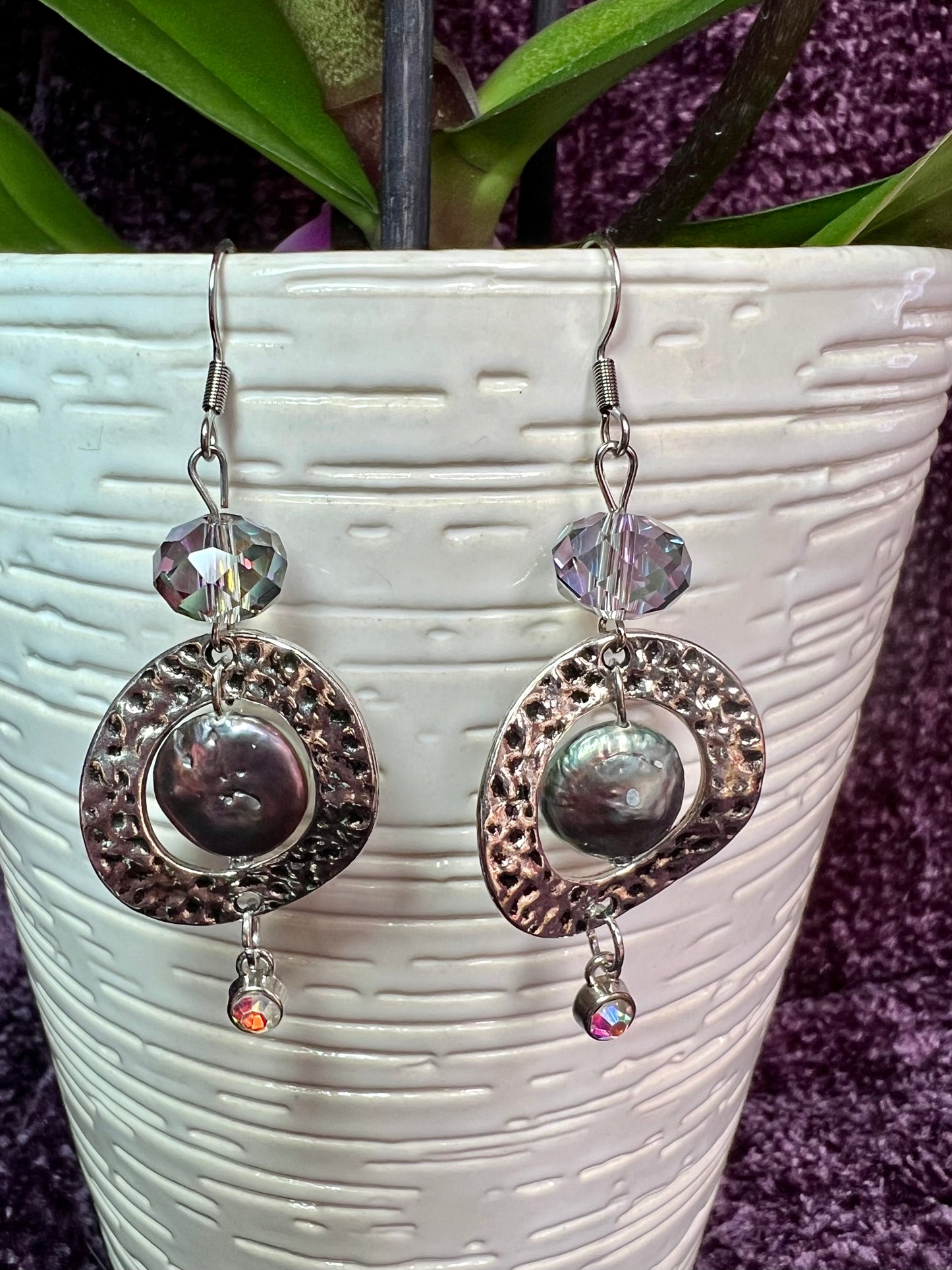 Earrings- Stainless steel ear hooks, silver plated metal and crystals, freshwater coin pearls, and crystal drop charm beads.