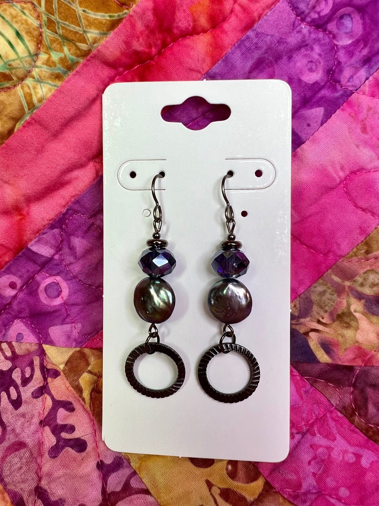 Earrings- Titanium ear hooks, gunmetal plated metal, crystals, and freshwater coin pearls.