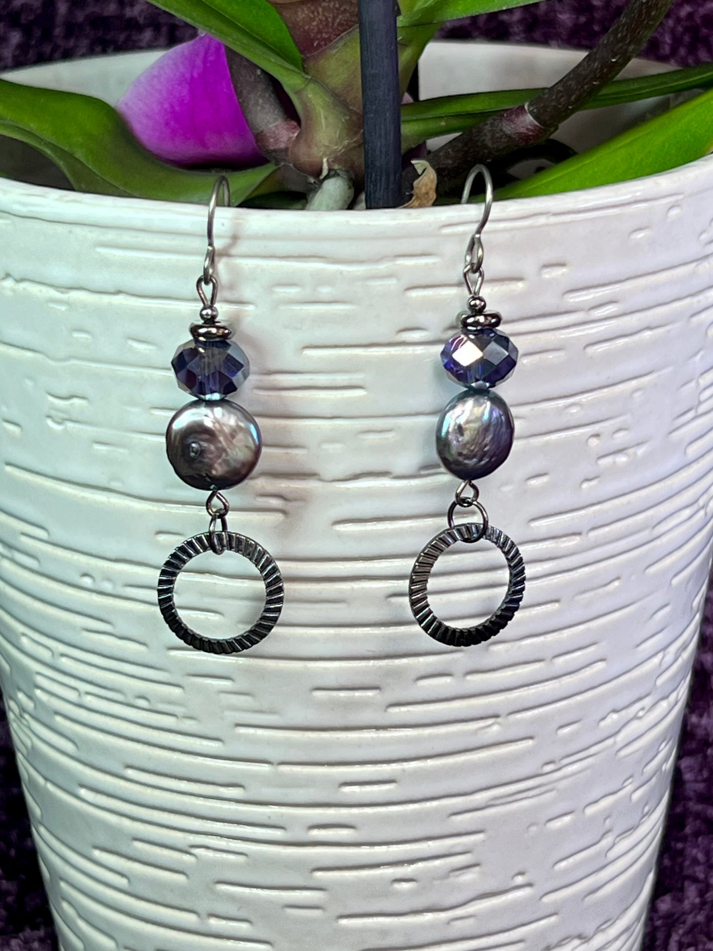 Earrings- Titanium ear hooks, gunmetal plated metal, crystals, and freshwater coin pearls.