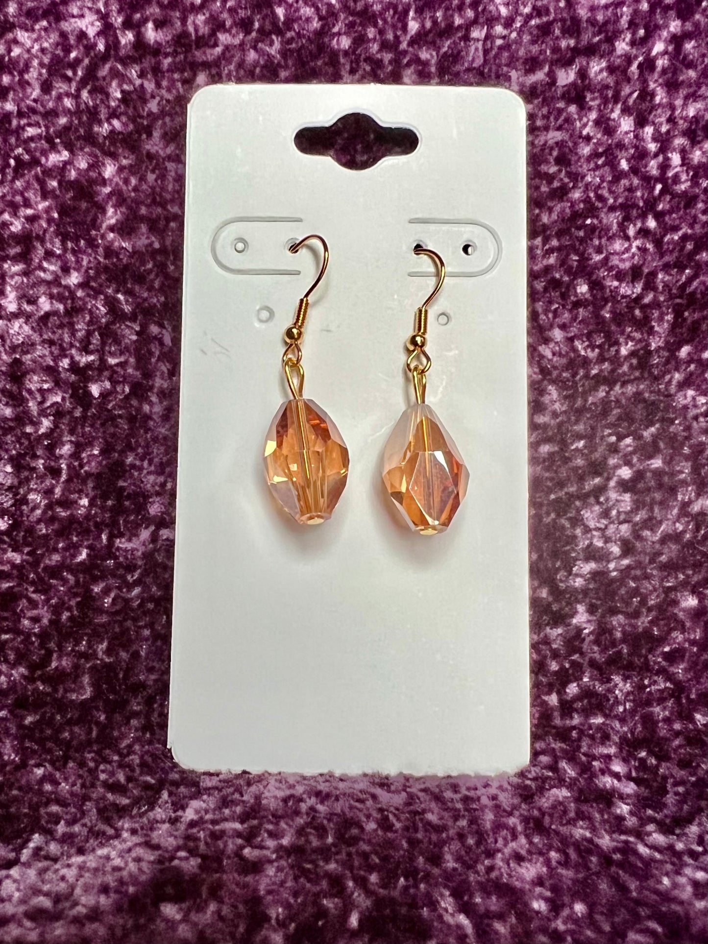 Earrings- Gold plated stainless steel ear hooks, gold plated metal with yellow/orange crystals.