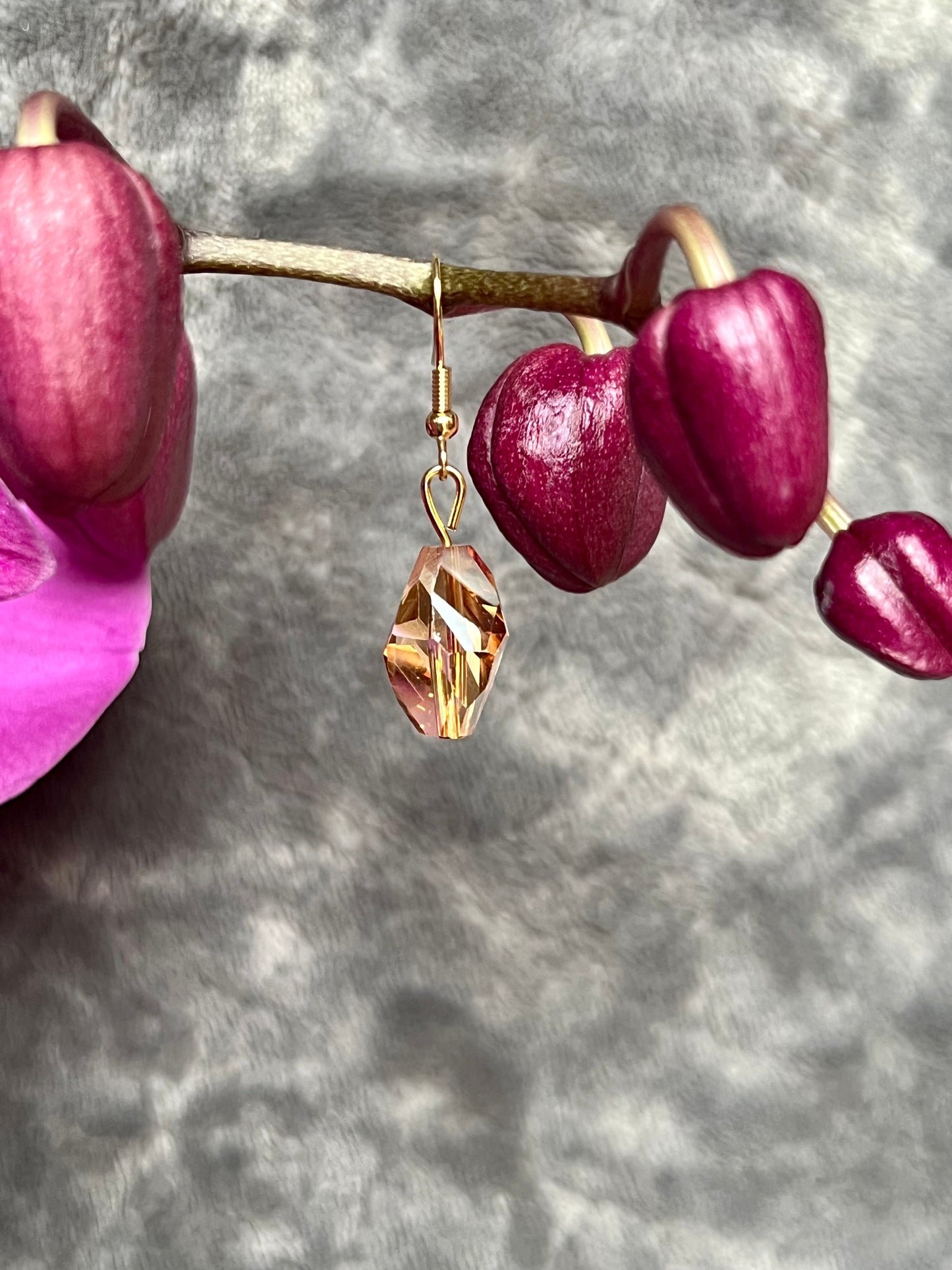 Earrings- Gold plated stainless steel ear hooks, gold plated metal with yellow/orange crystals.