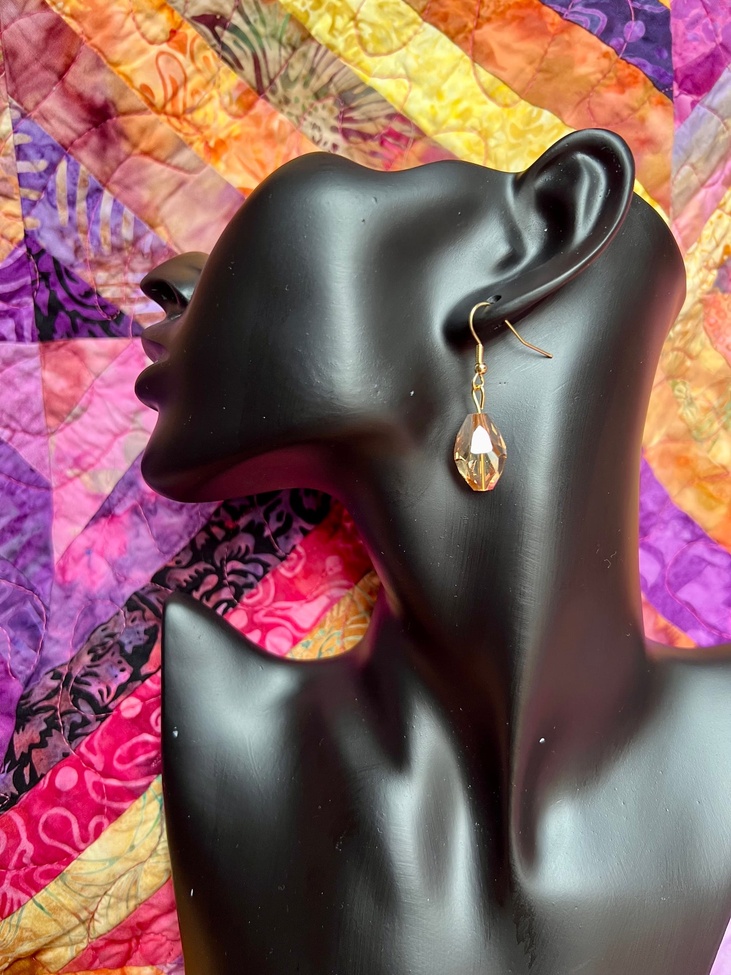 Earrings- Gold plated stainless steel ear hooks, gold plated metal with yellow/orange crystals.