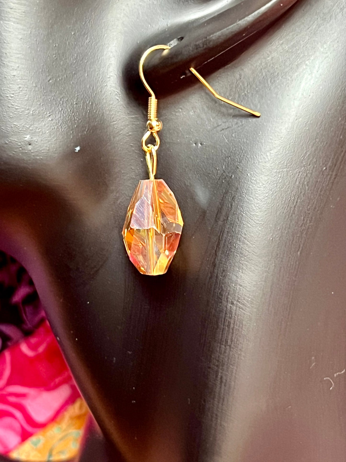 Earrings- Gold plated stainless steel ear hooks, gold plated metal with yellow/orange crystals.