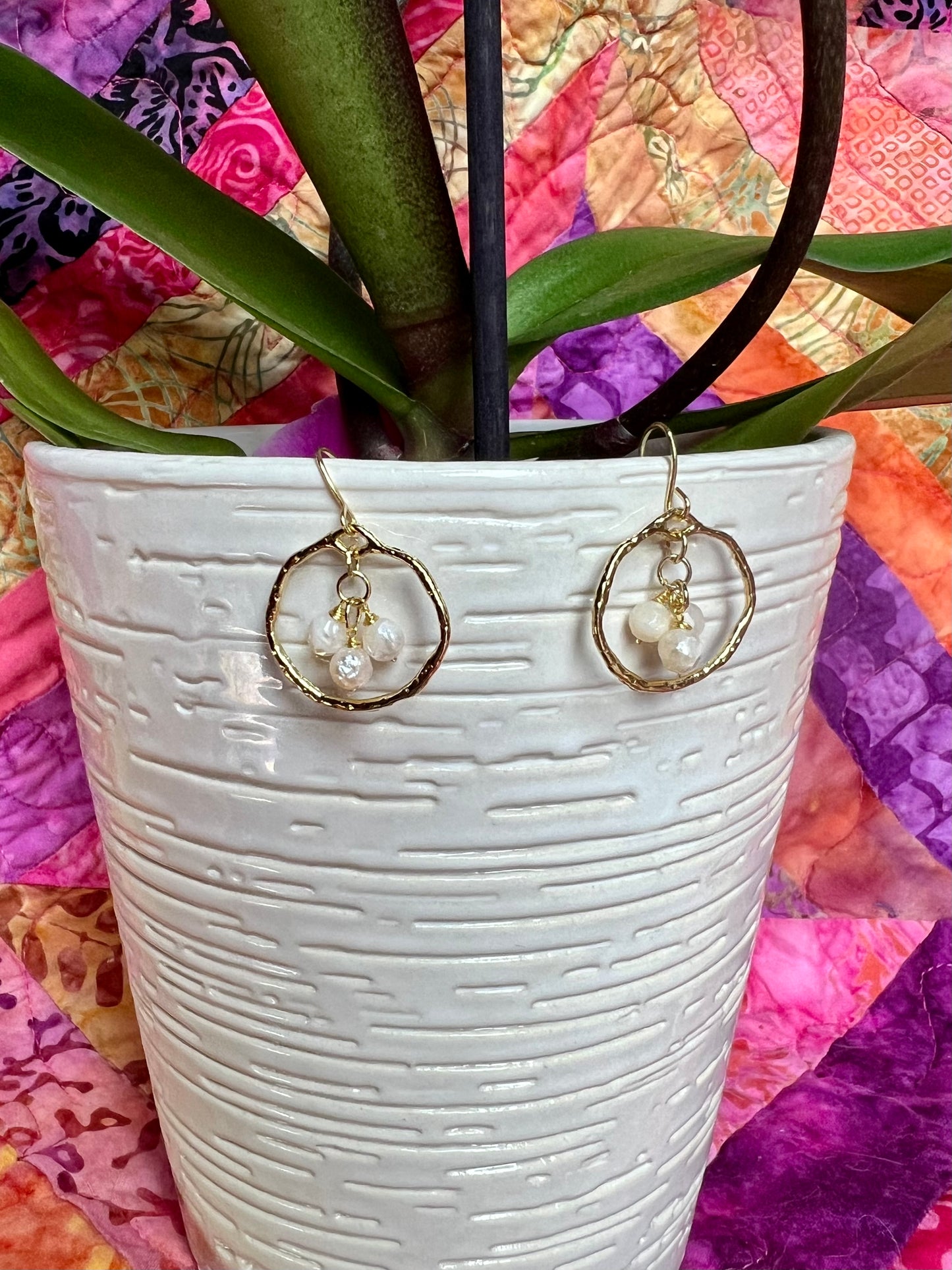 Earrings- Light gold plated metal with wire wrapped white faceted genuine freshwater pearls.