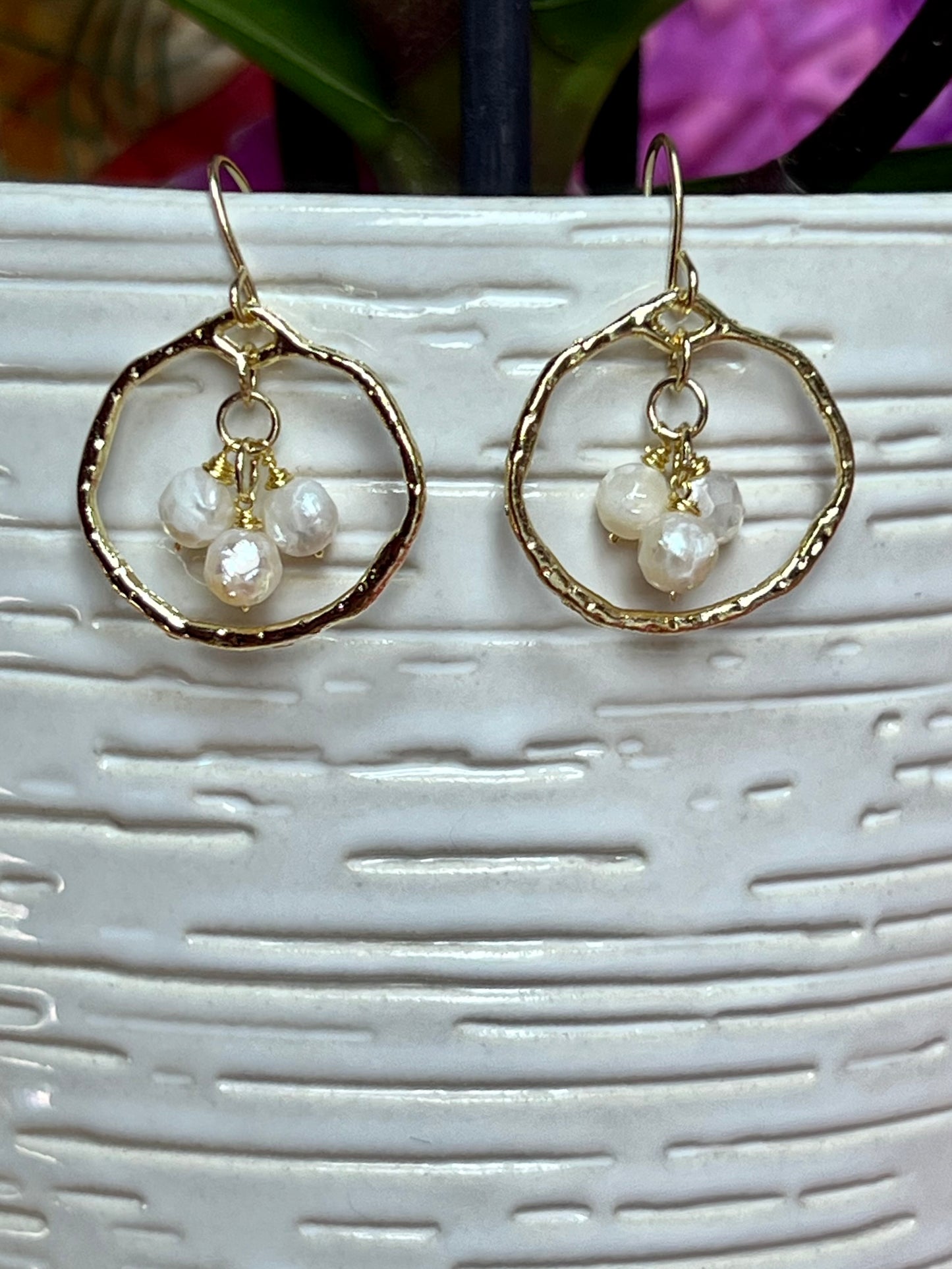 Earrings- Light gold plated metal with wire wrapped white faceted genuine freshwater pearls.