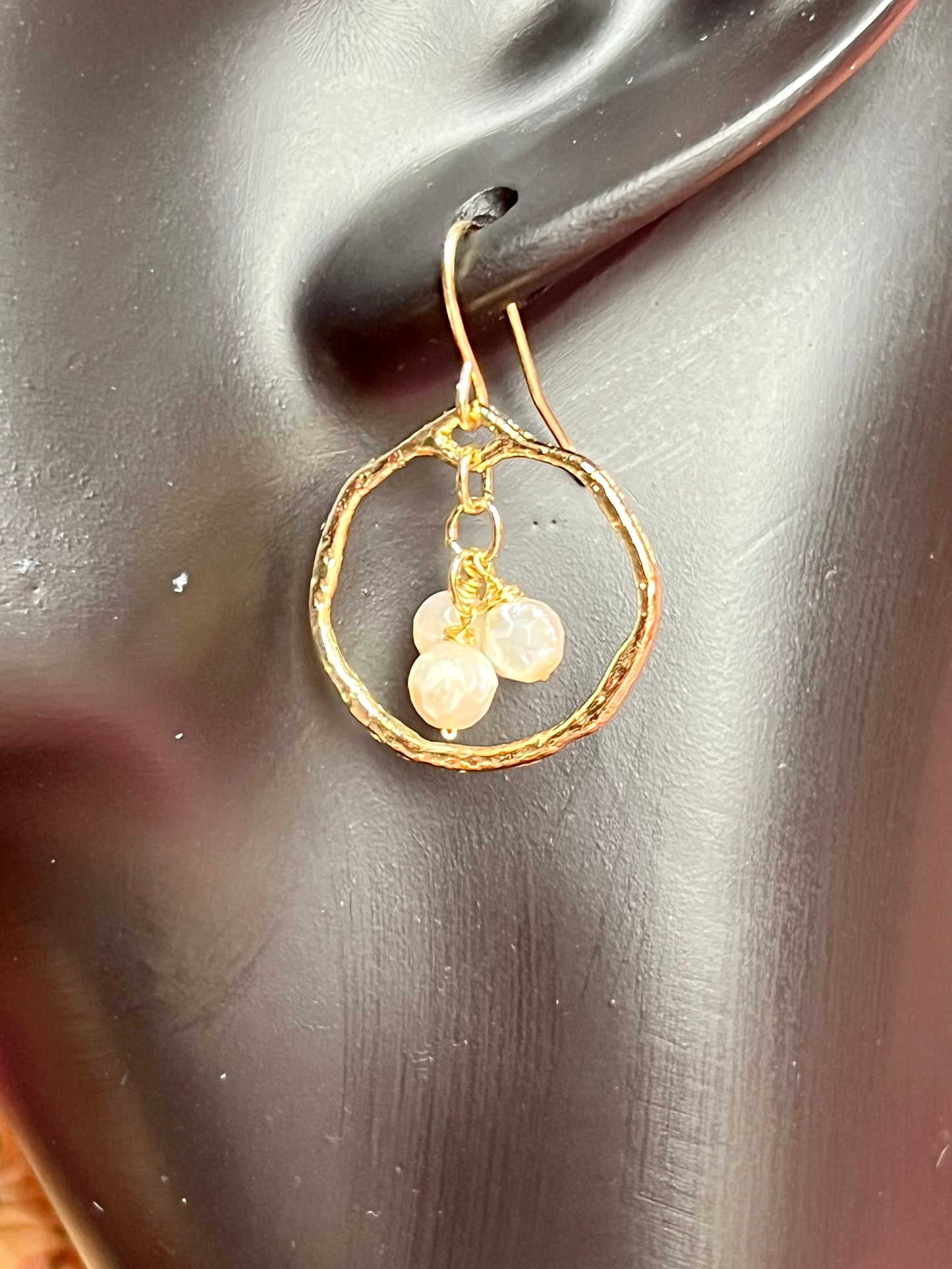 Earrings- Light gold plated metal with wire wrapped white faceted genuine freshwater pearls.