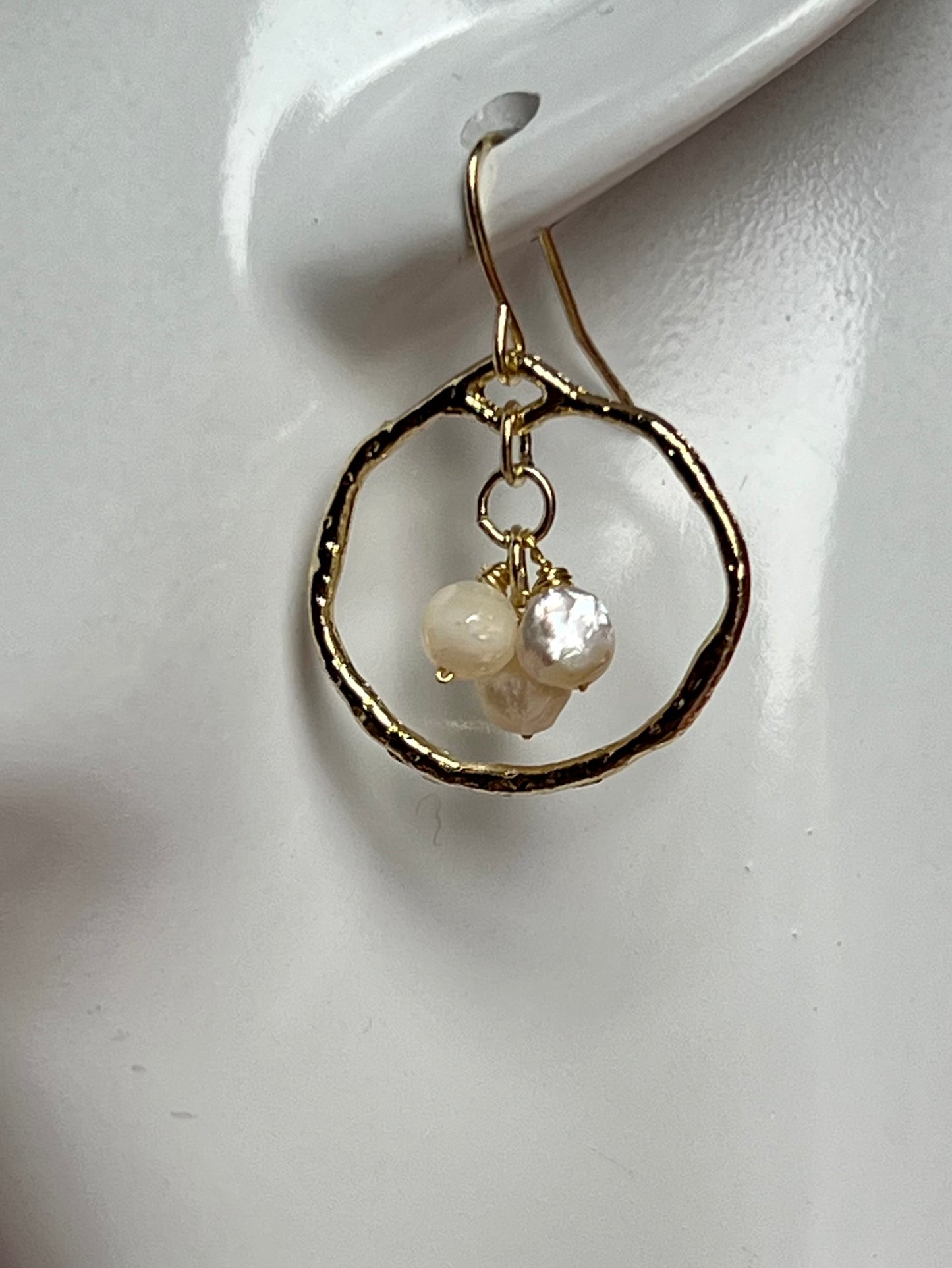 Earrings- Light gold plated metal with wire wrapped white faceted genuine freshwater pearls.