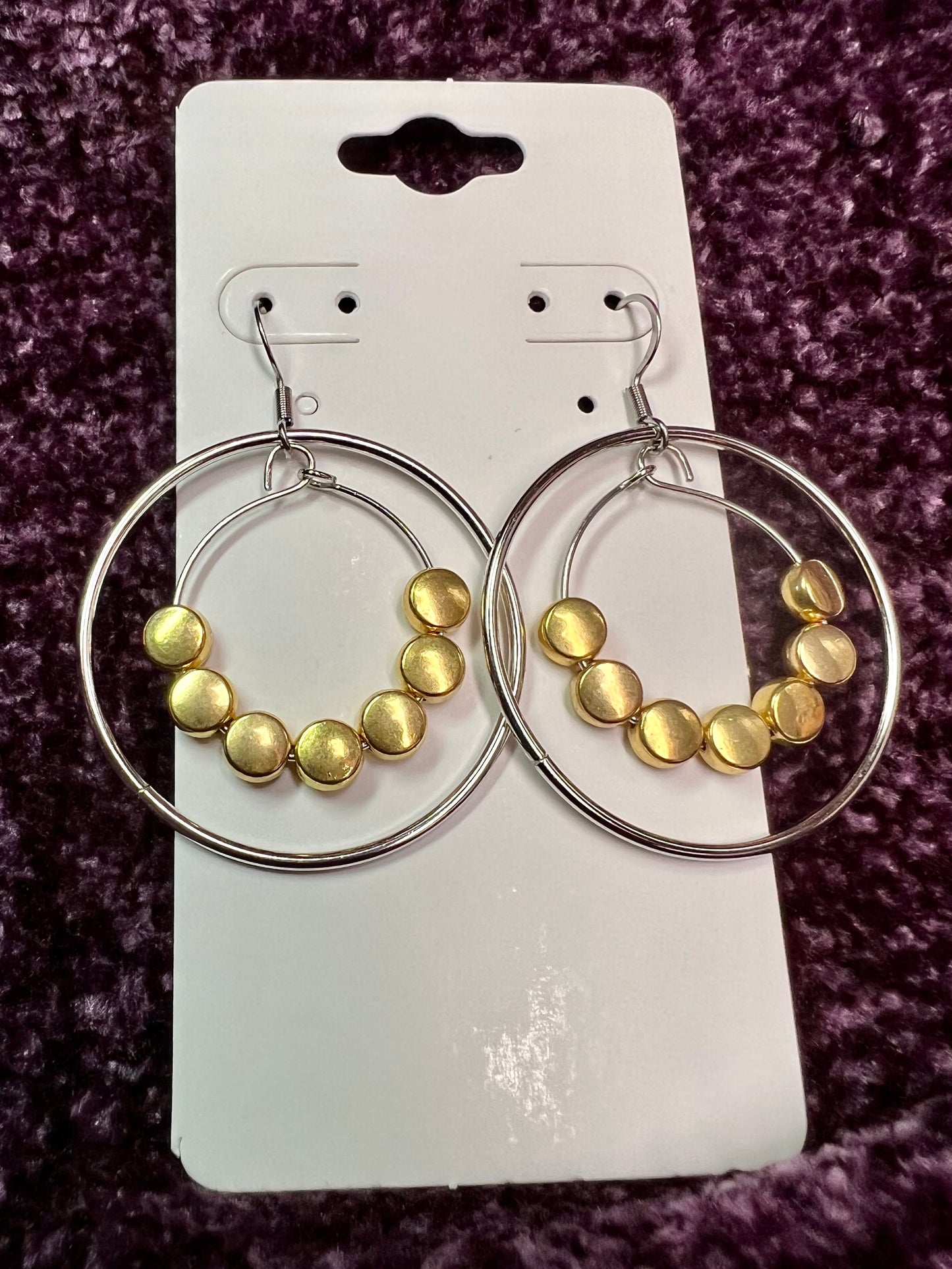 Earrings- Stainless steel ear wires, silver plated metal with gold plated metal coin shaped beads.