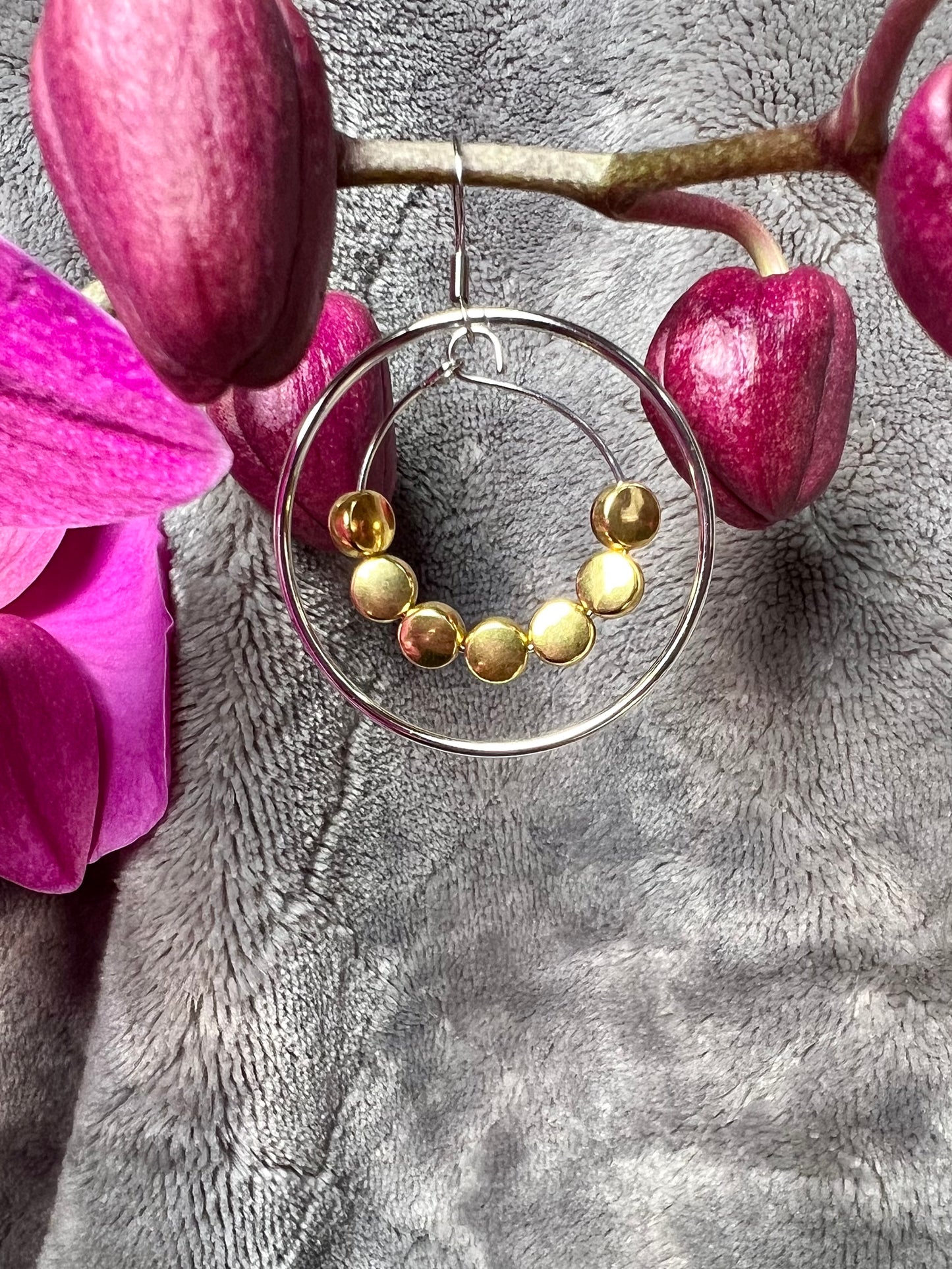 Earrings- Stainless steel ear wires, silver plated metal with gold plated metal coin shaped beads.