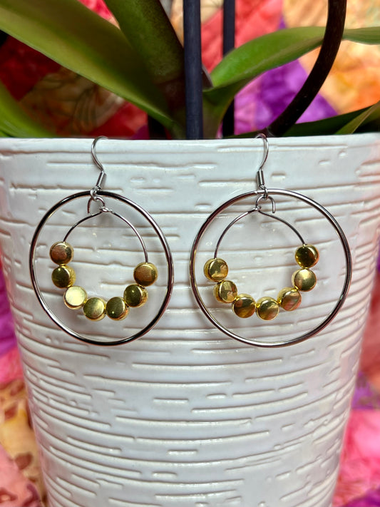 Earrings- Stainless steel ear wires, silver plated metal with gold plated metal coin shaped beads.