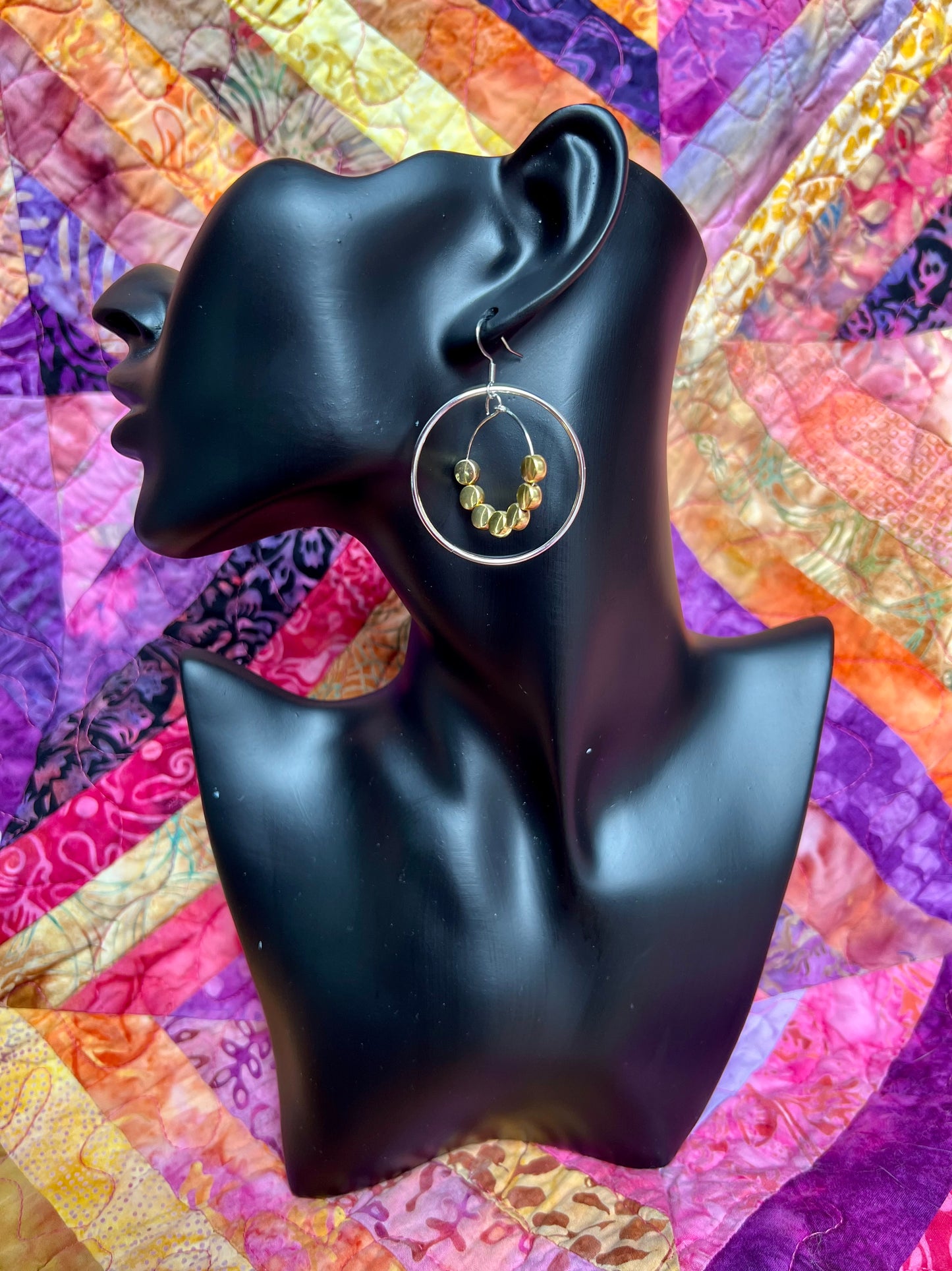 Earrings- Stainless steel ear wires, silver plated metal with gold plated metal coin shaped beads.
