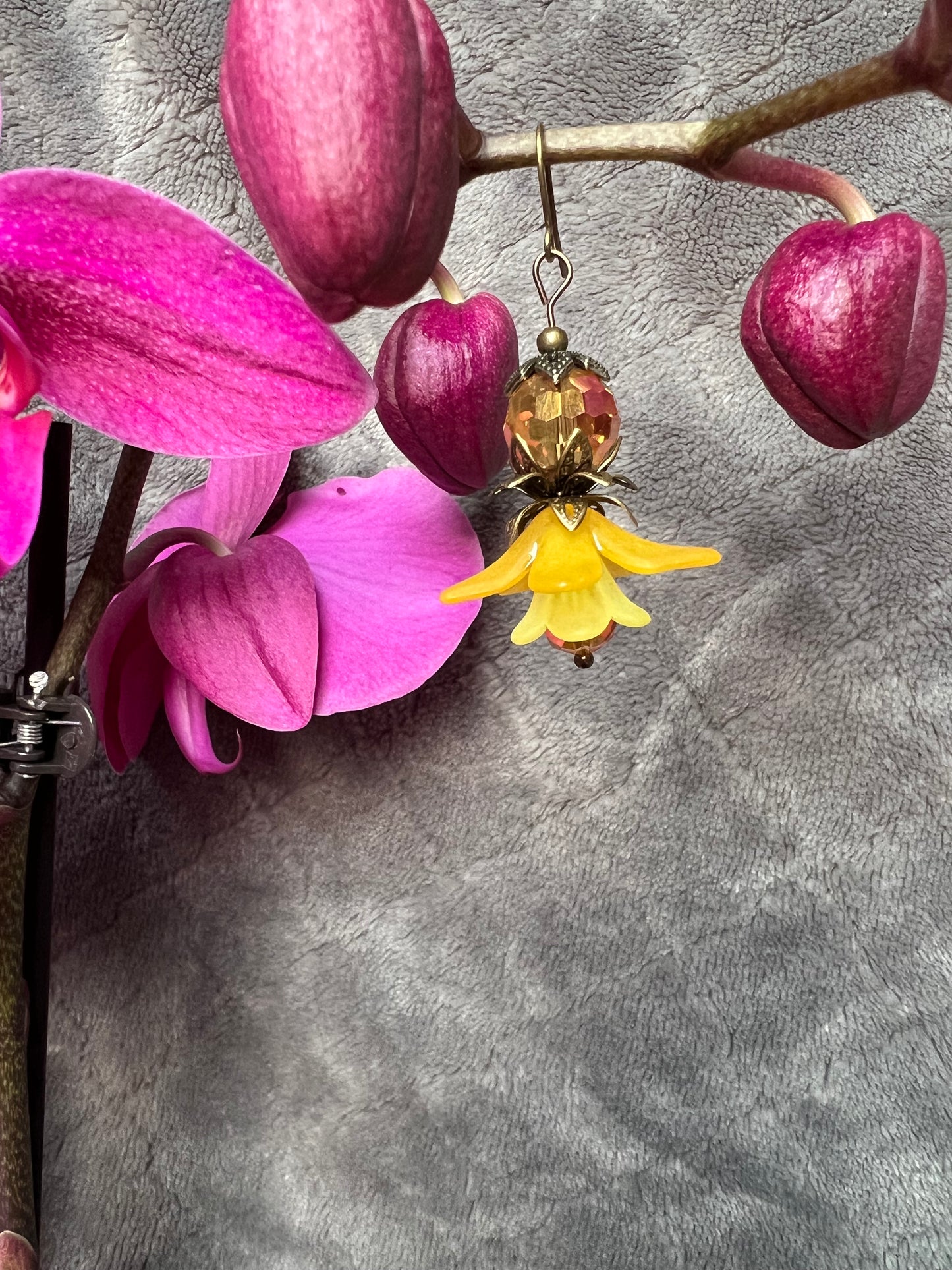 Earrings- Antique gold plated metal with acrylic yellow flower beads and crystal beads.