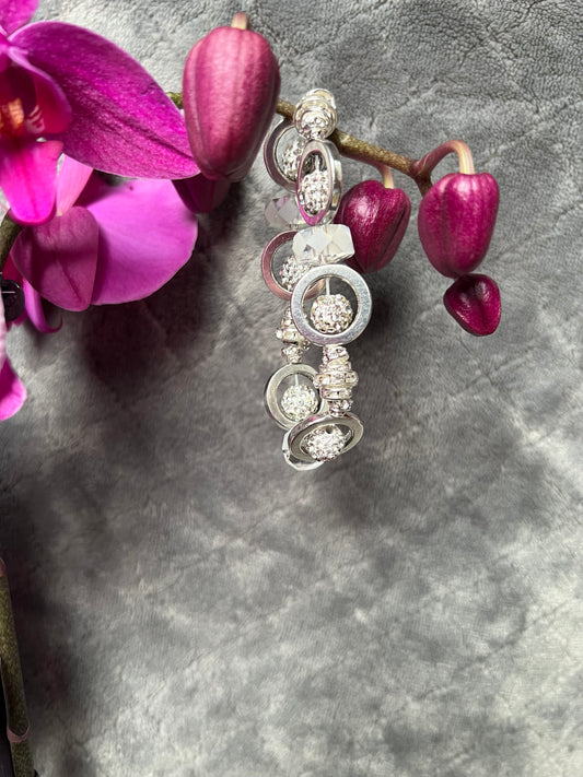 Bracelet- Silver plated metal, clear rondelles, rhinestones, and crystals.