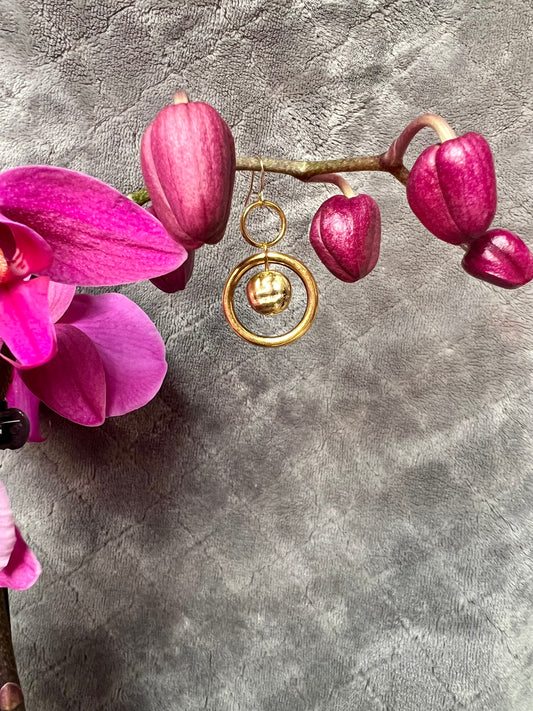 Earrings- Antiqued gold plated metal, hoops and coin shaped bead.