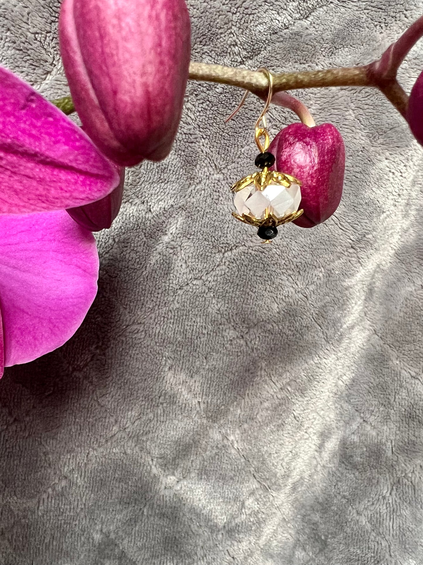 Earrings- Gold plated metal with black and clear crystals.