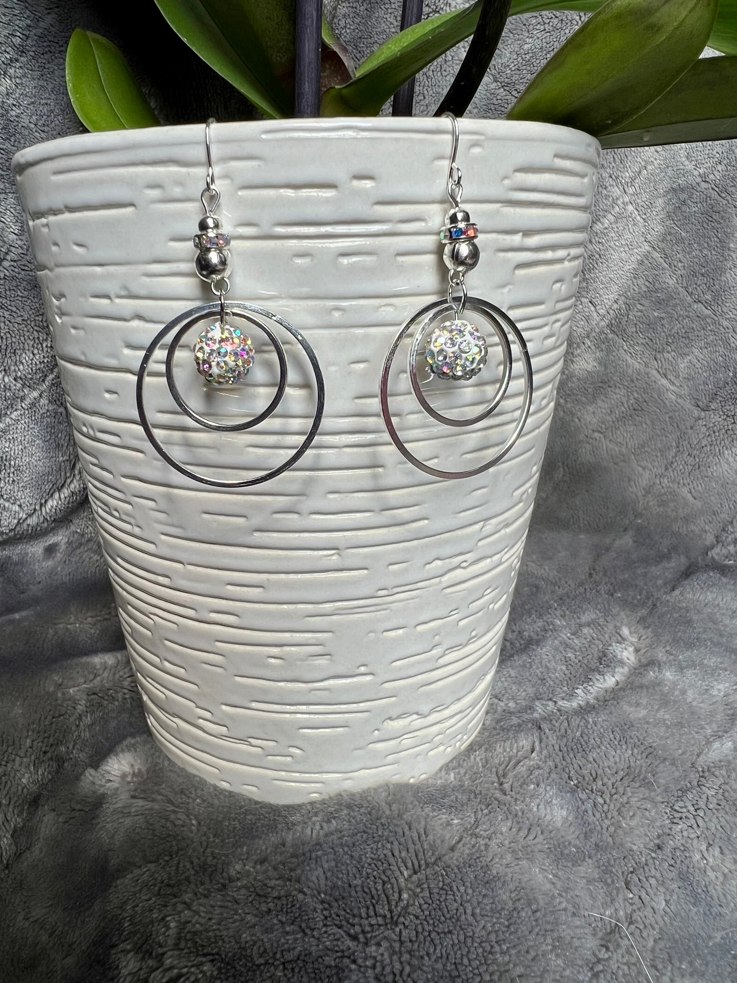 Earrings- Silver plated metal with AB crystal rondelle & clay bead with AB rhinestones.