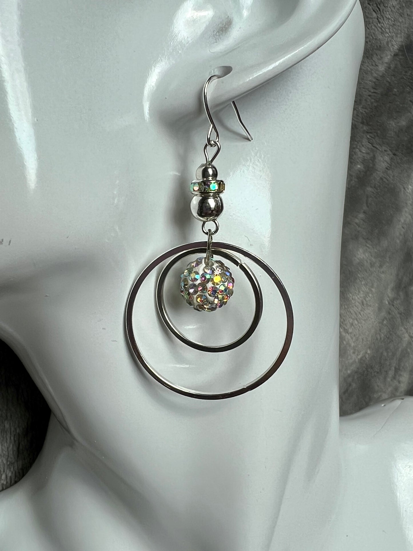 Earrings- Silver plated metal with AB crystal rondelle & clay bead with AB rhinestones.