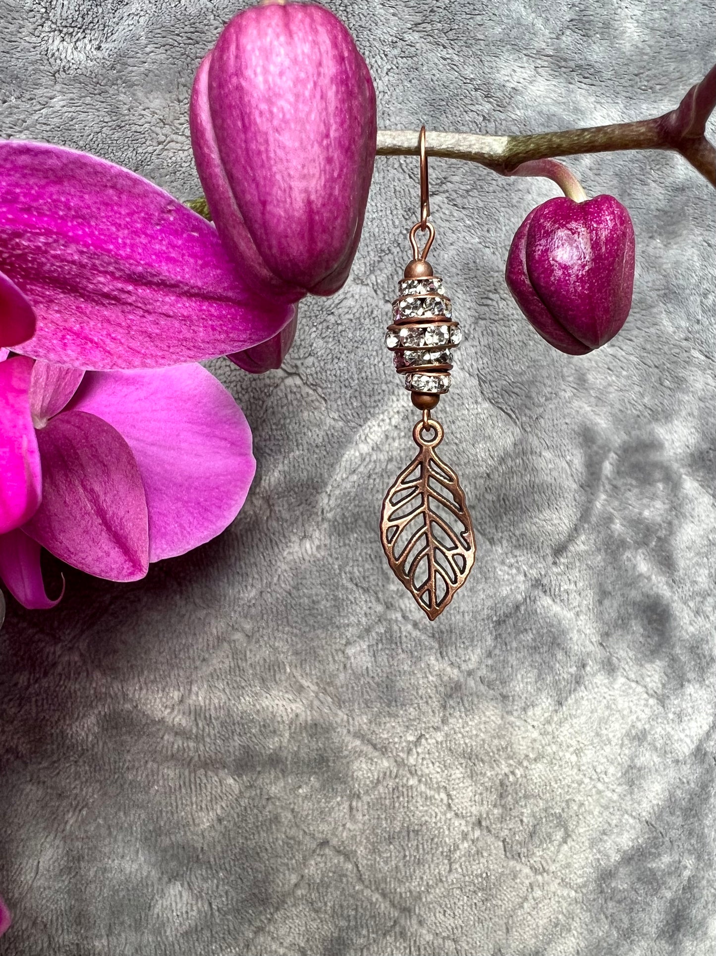 Earrings- Antique copper plated metal leaves with clear crystal rondelles.