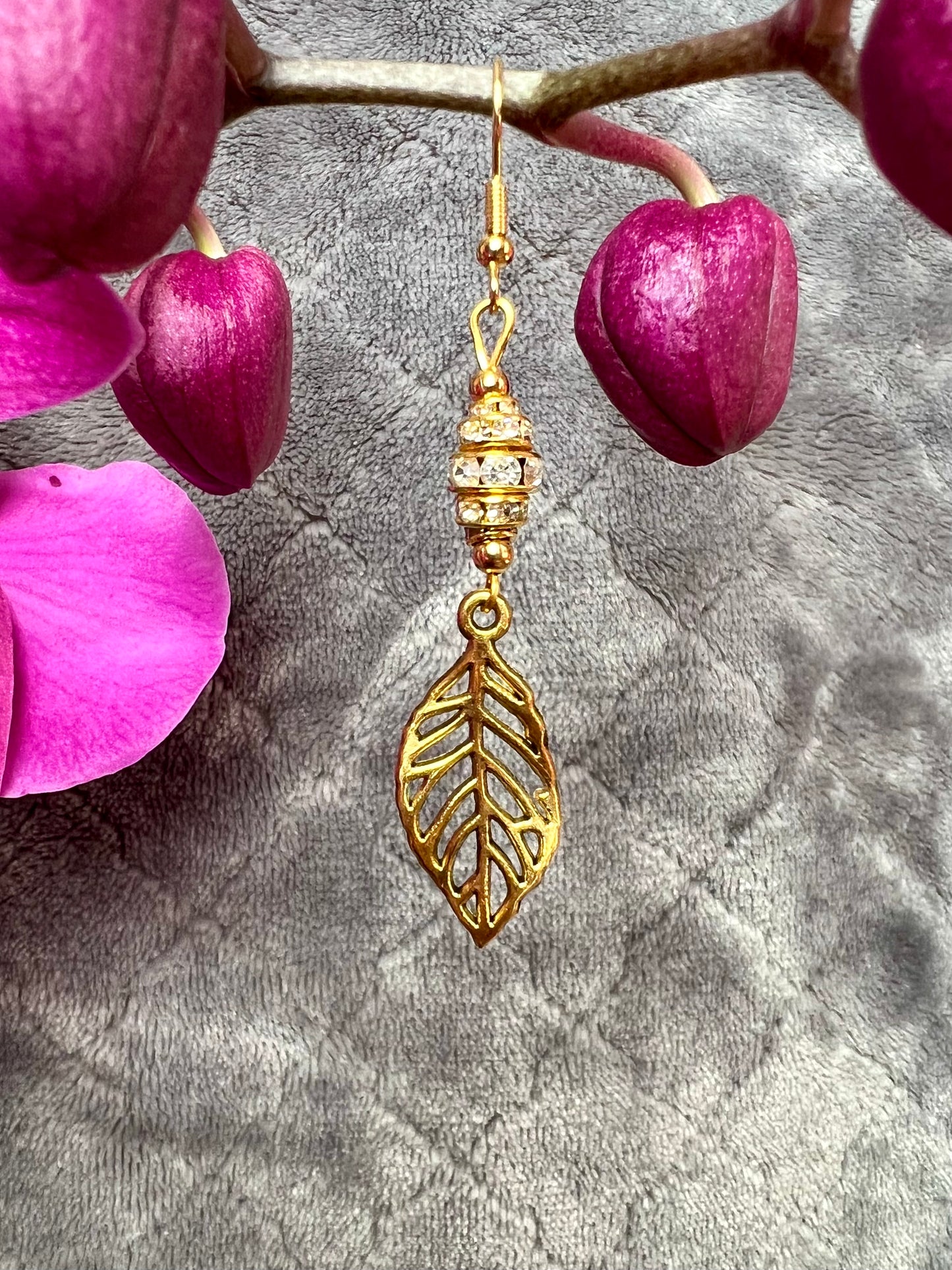 Earrings- Gold plated metal leaves with clear crystal rondelles.