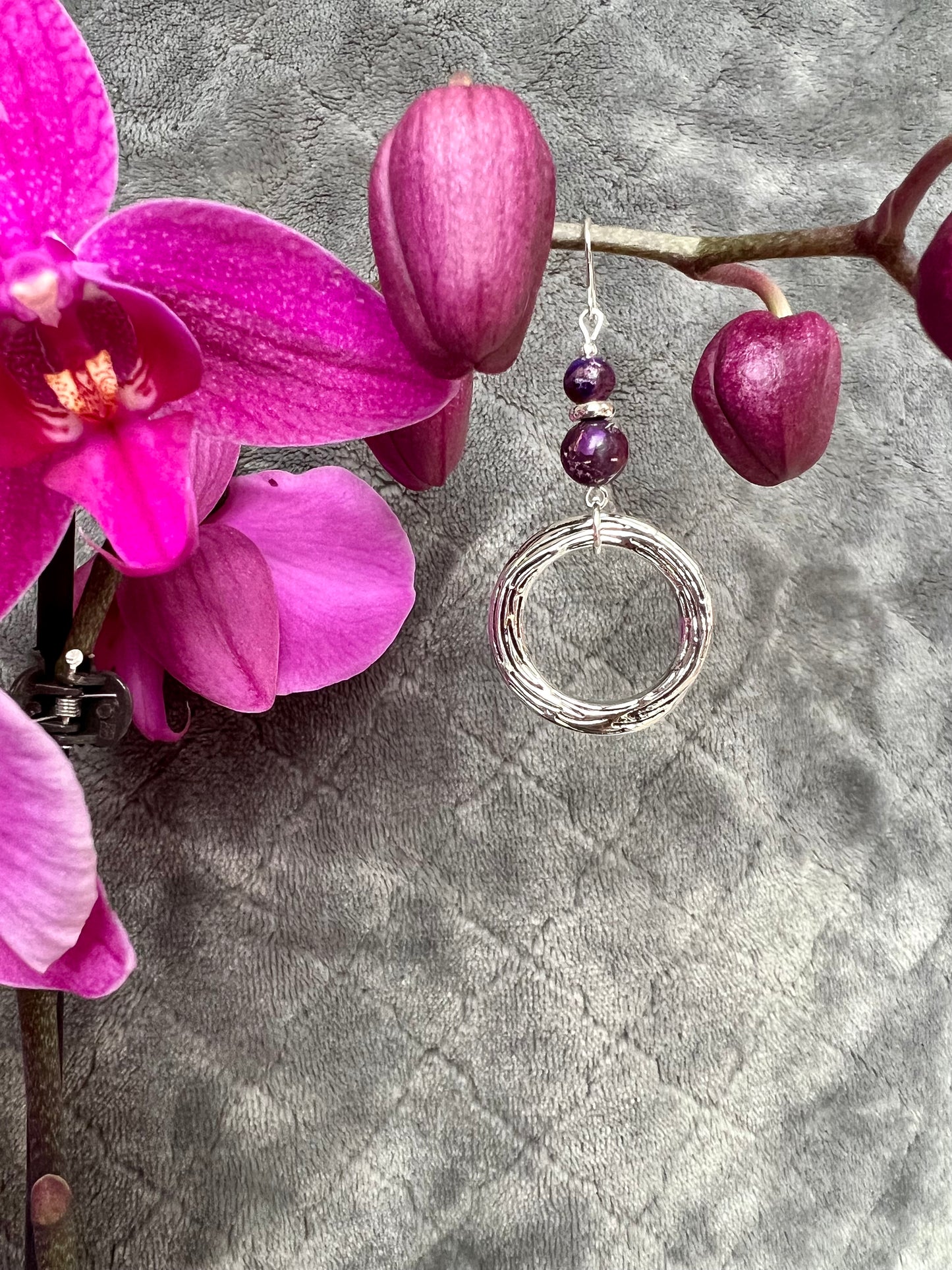 Earrings- Silver plated metal with purple dyed natural stone beads.