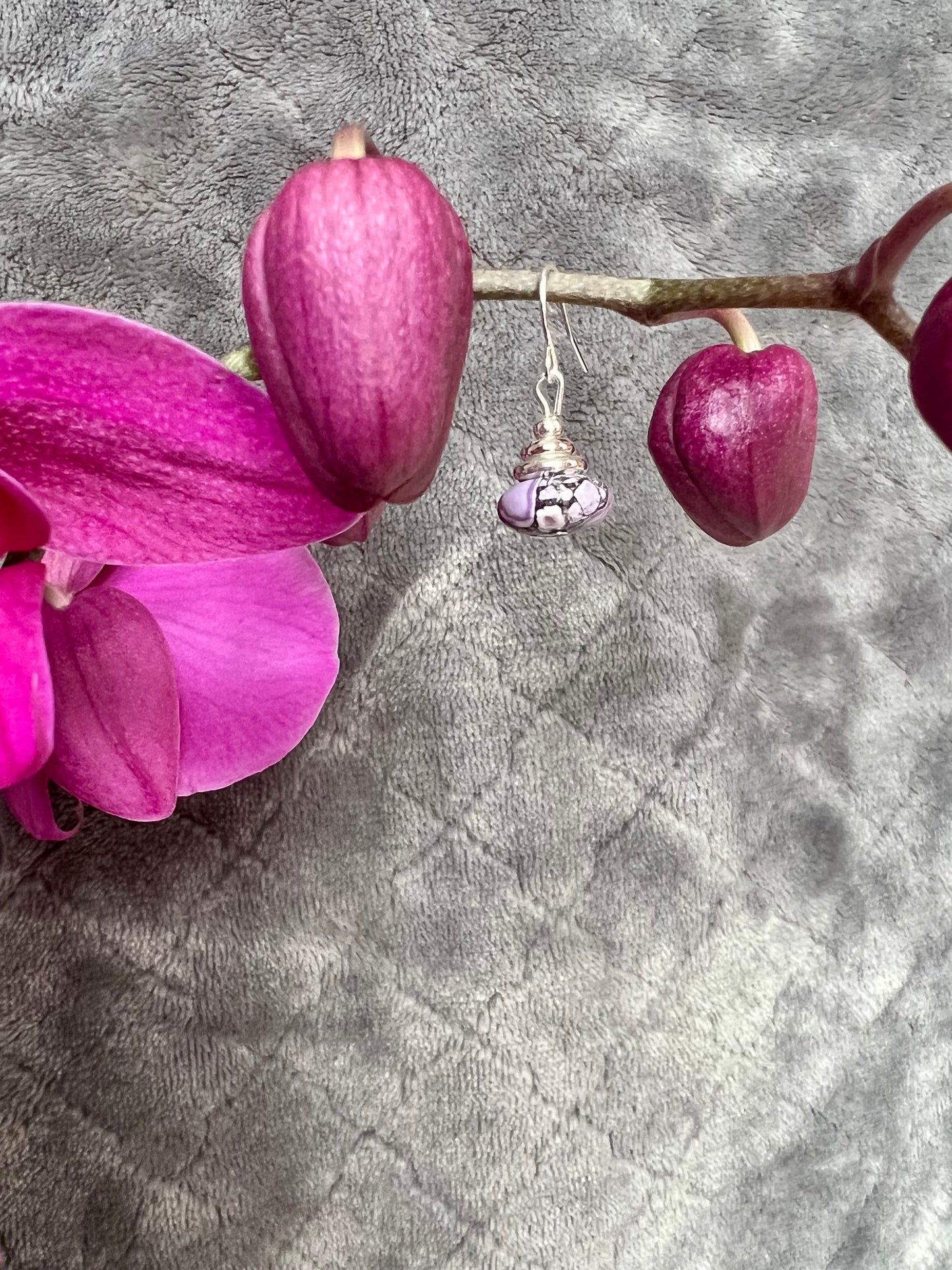 Earrings- Silver plated metal with purple dyed stone.