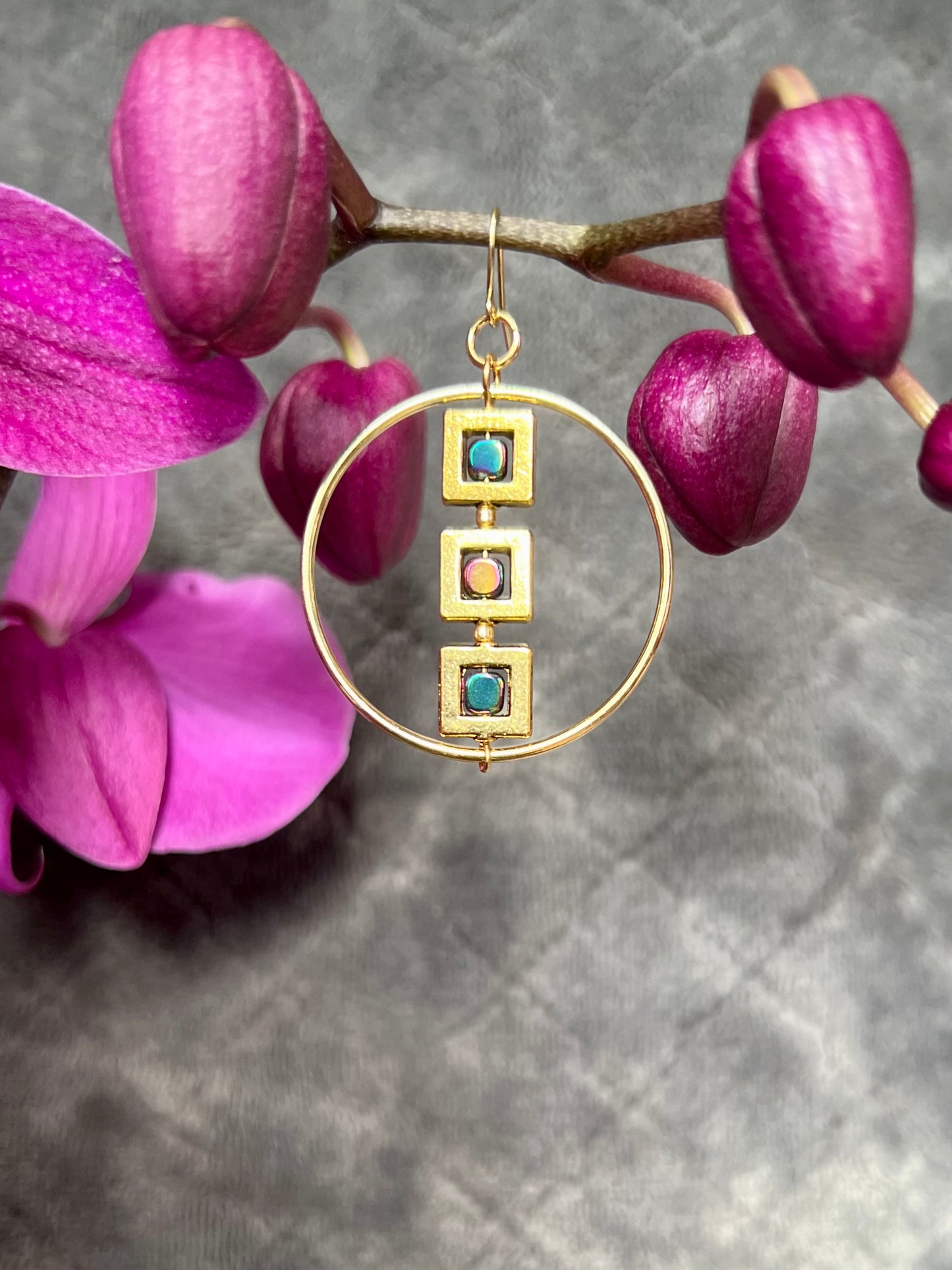 Earrings- Gold plated metal hoops with squares and metallic rainbow hematite cube seed beads.