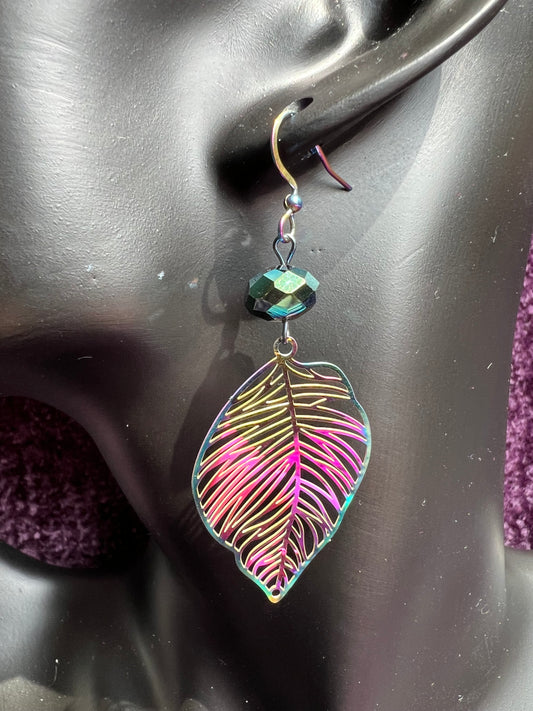 Earrings- Rainbow coated stainless steel leaves and ear wires with metallic green crystal beads.