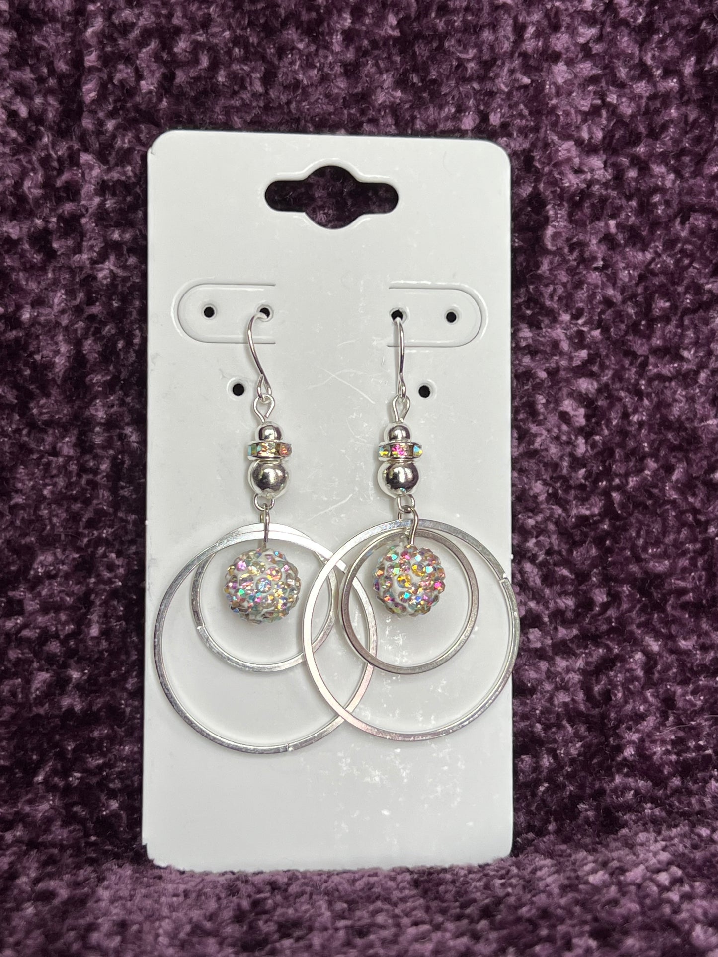 Earrings- Silver plated metal with AB crystal rondelle & clay bead with AB rhinestones.