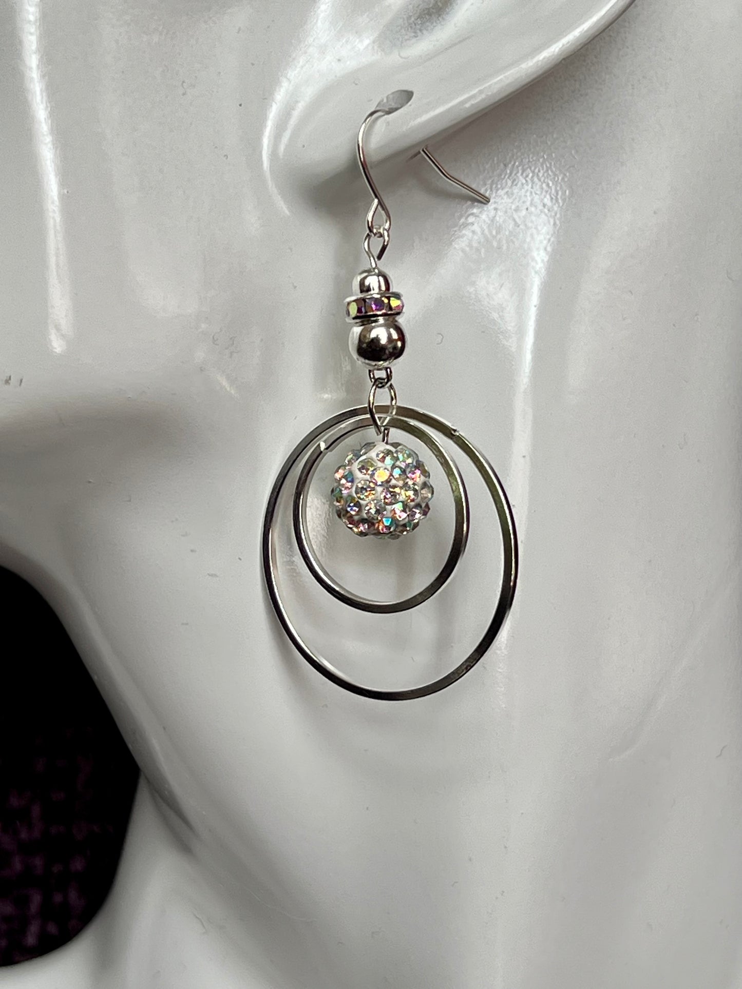 Earrings- Silver plated metal with AB crystal rondelle & clay bead with AB rhinestones.