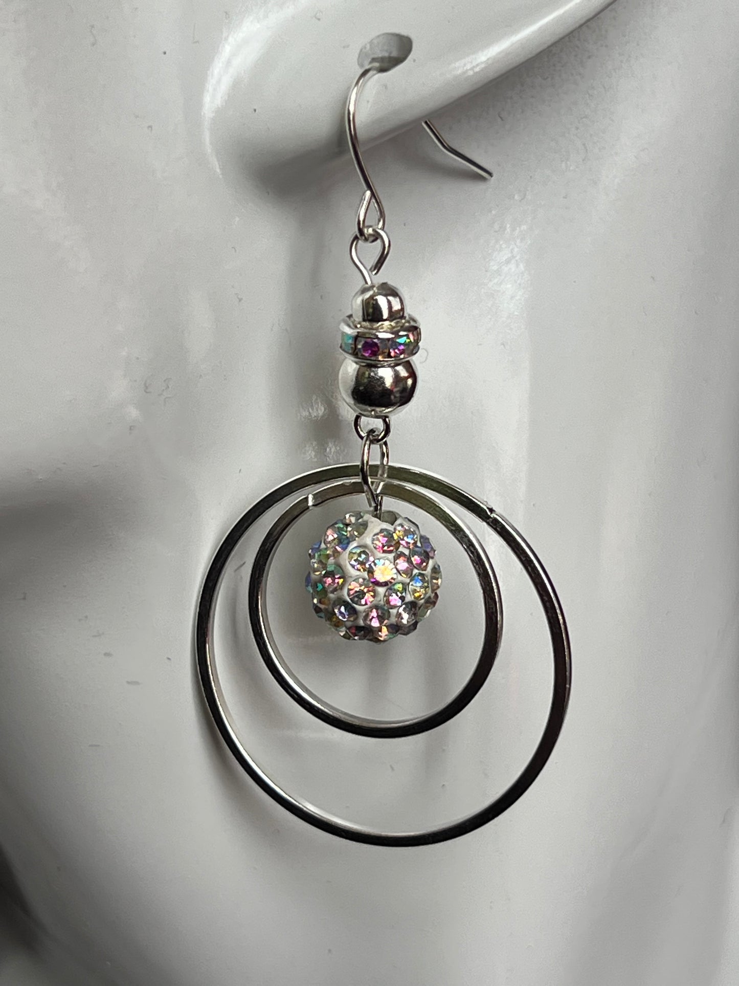 Earrings- Silver plated metal with AB crystal rondelle & clay bead with AB rhinestones.