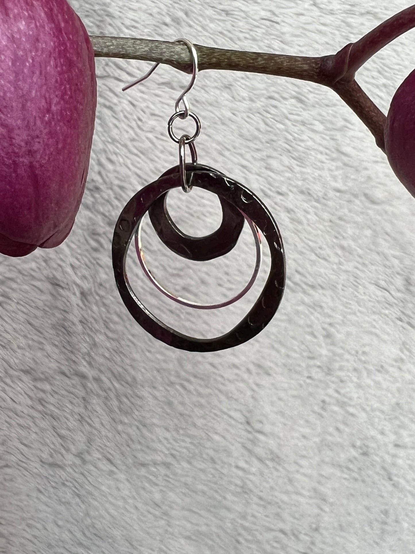 Earrings- Gun metal and silver plated metal hoops.