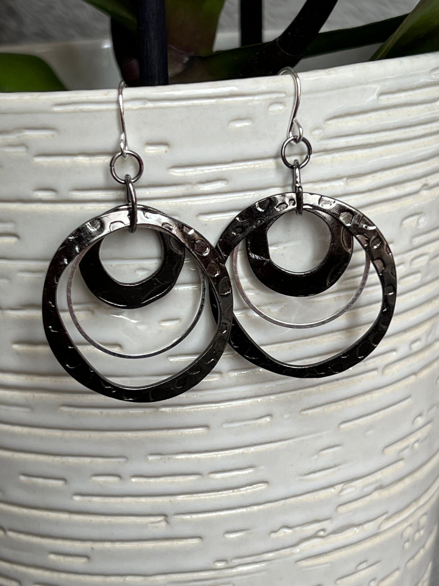 Earrings- Gun metal and silver plated metal hoops.