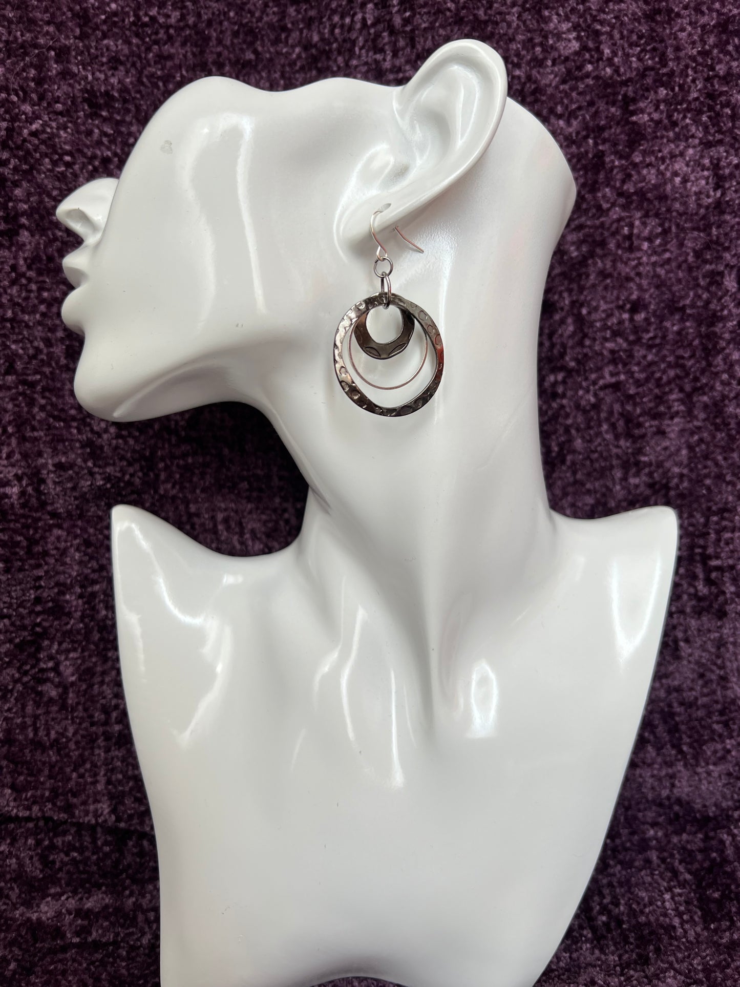 Earrings- Gun metal and silver plated metal hoops.