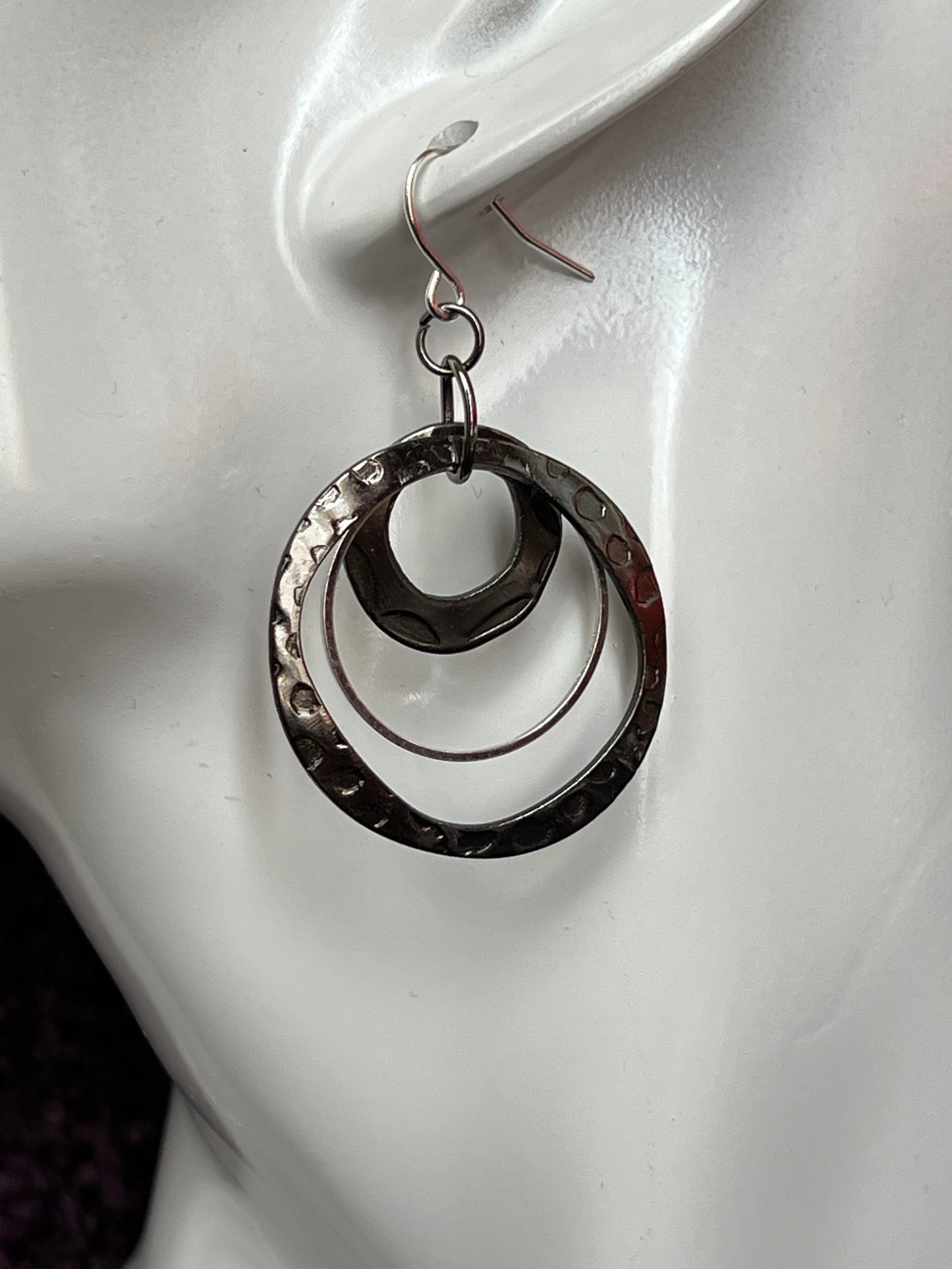 Earrings- Gun metal and silver plated metal hoops.