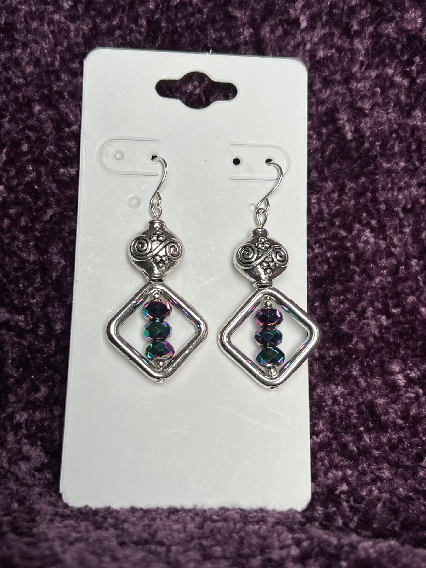 Earrings- Antiqued silver plated metal beads with rainbow Chinese crystals.