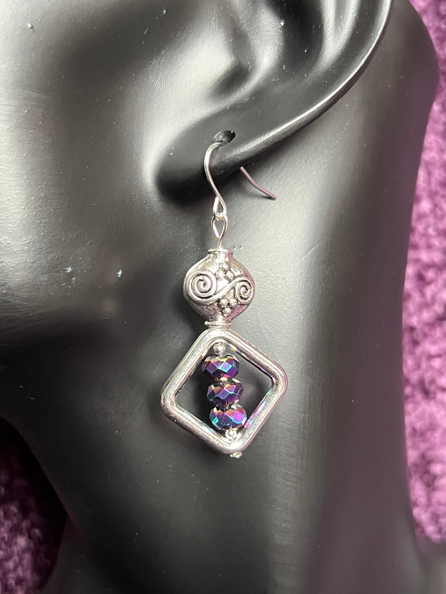 Earrings- Antiqued silver plated metal beads with rainbow Chinese crystals.