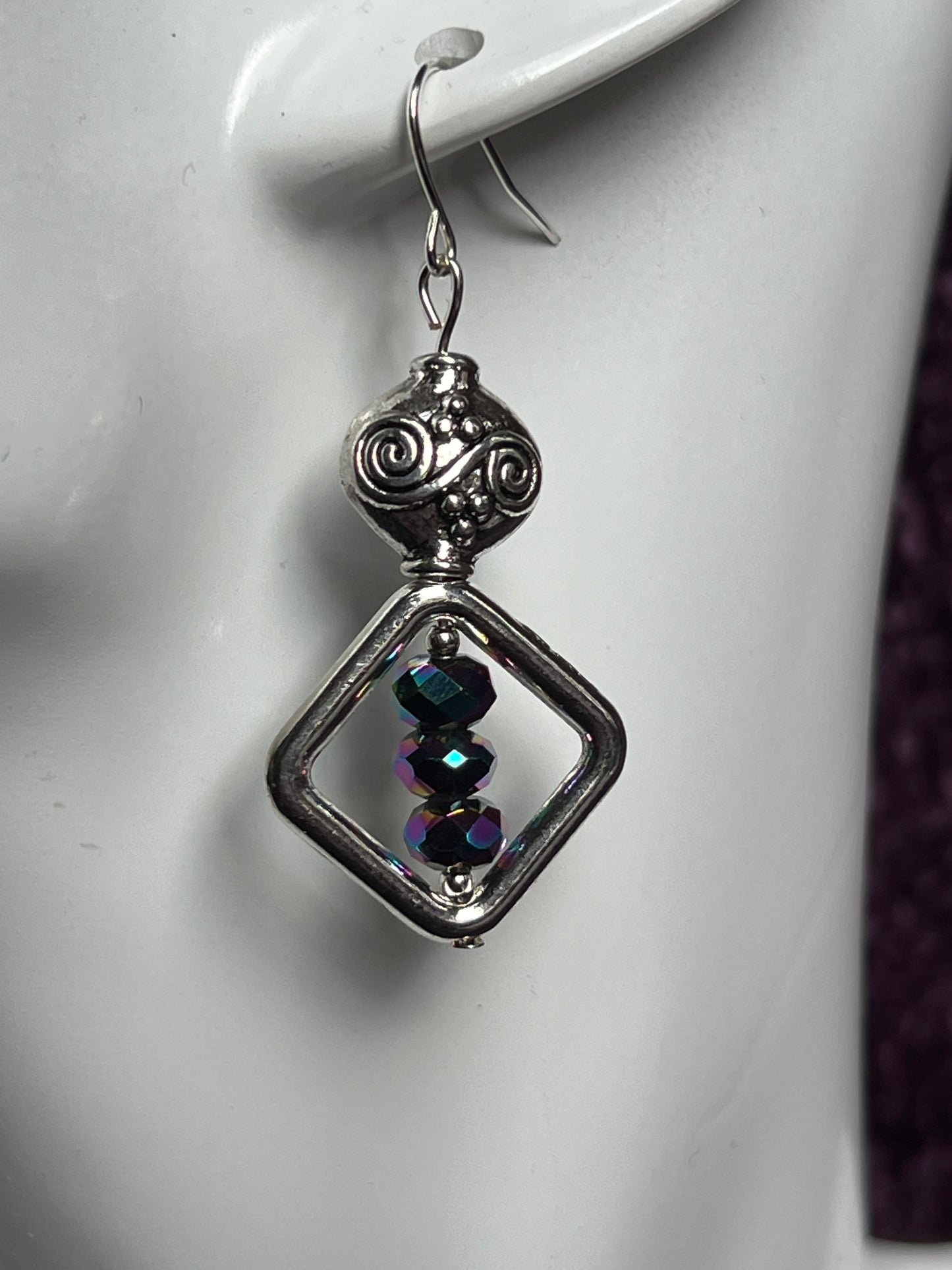 Earrings- Antiqued silver plated metal beads with rainbow Chinese crystals.