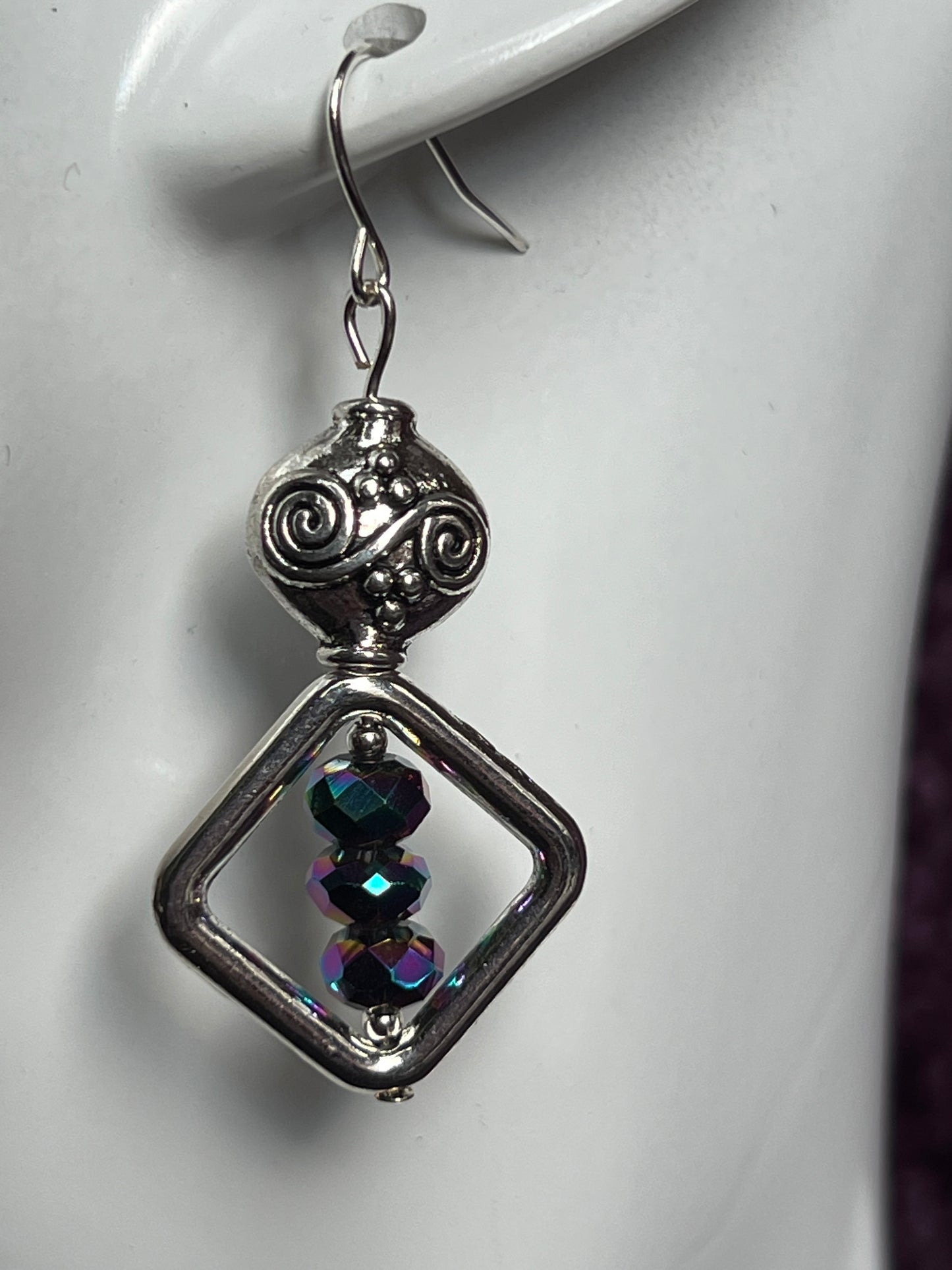 Earrings- Antiqued silver plated metal beads with rainbow Chinese crystals.