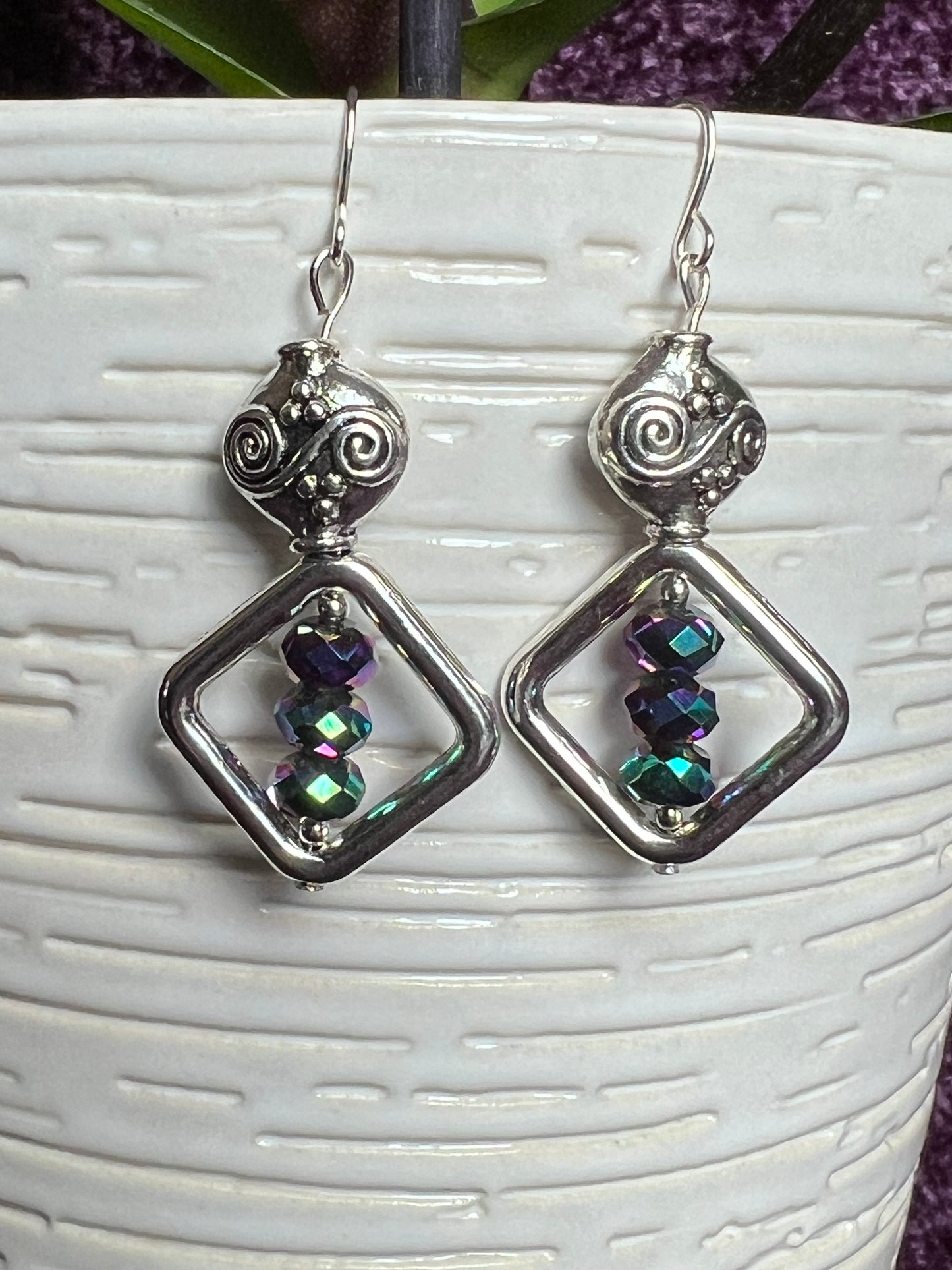 Earrings- Antiqued silver plated metal beads with rainbow Chinese crystals.