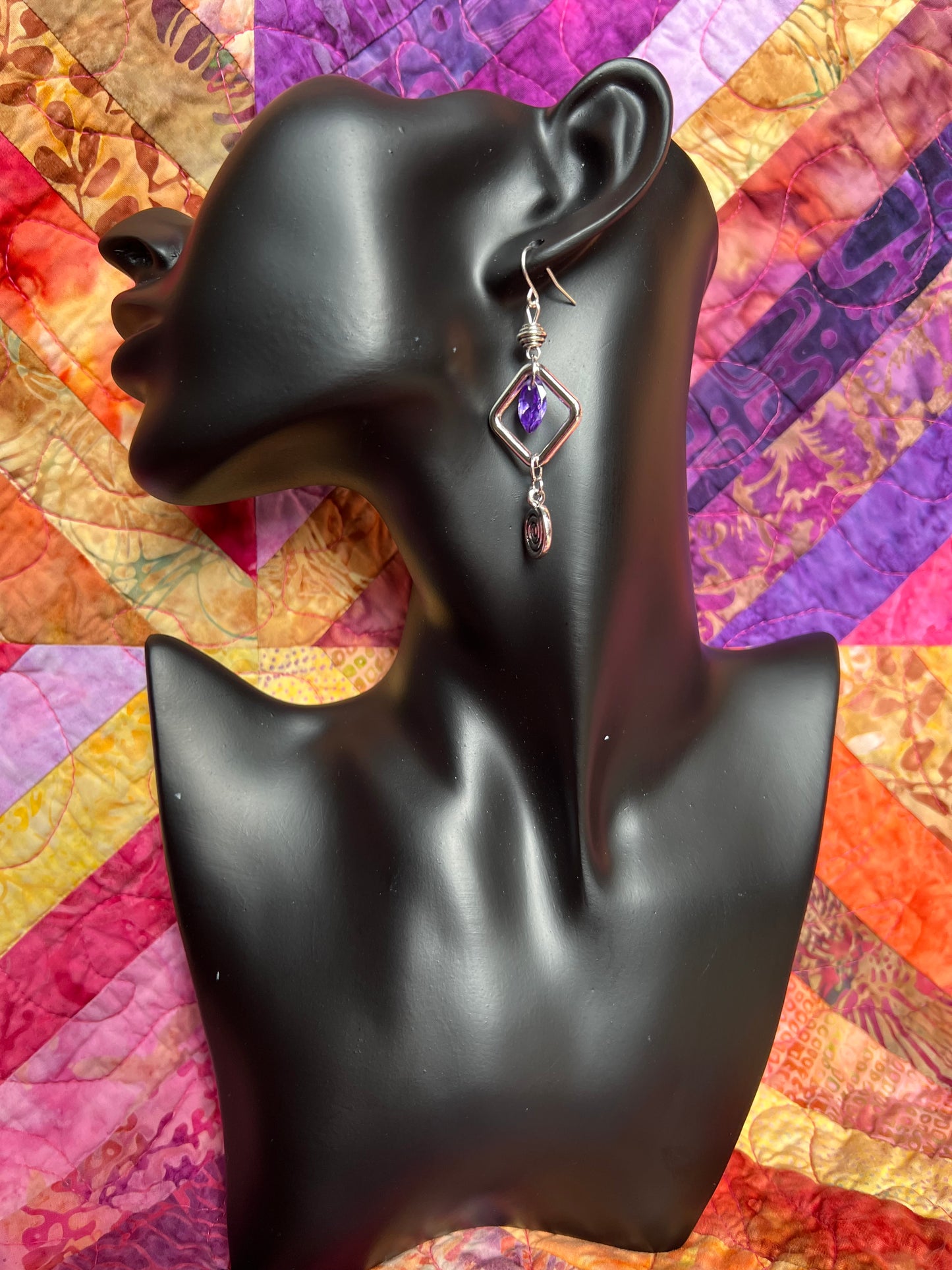 Earrings- Antiqued silver plated metal beads with purple cubic zirconia beads and swirl bead.