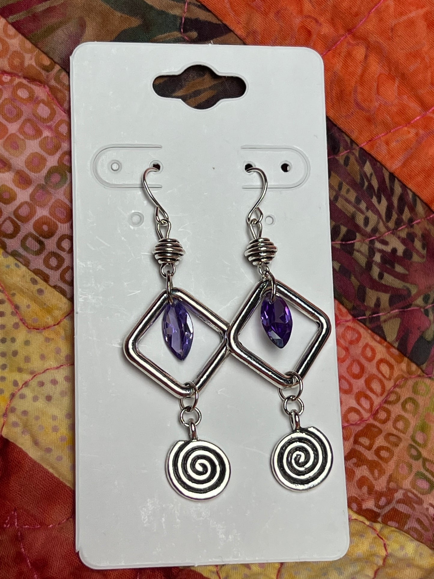 Earrings- Antiqued silver plated metal beads with purple cubic zirconia beads and swirl bead.