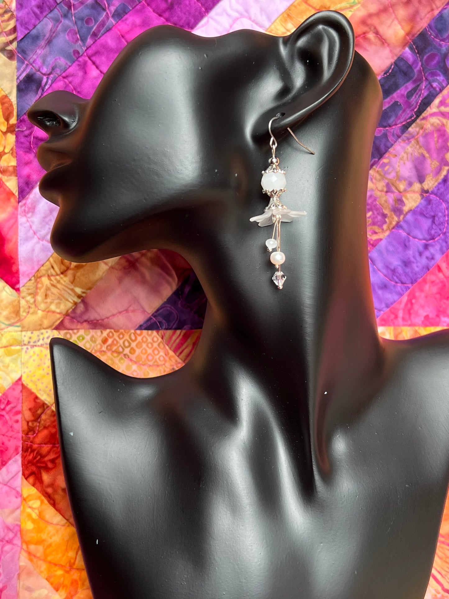 Earrings- Silver plated metal with fresh water pearls, crystals, and white acrylic flowers.